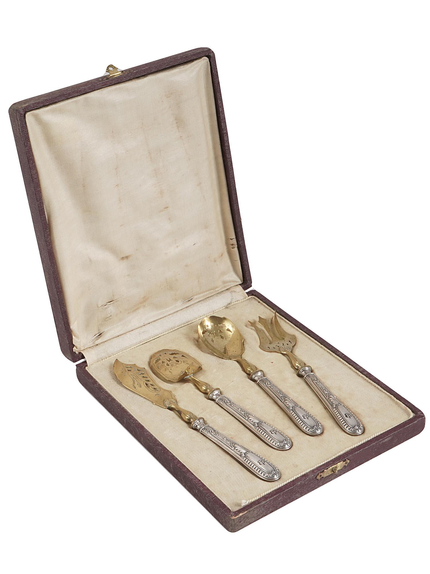 WWII NAZI GERMAN EVA BRAUN SILVER FISH SET: A WWII Nazi German silver tableware fish set of four items with gilt lower tool parts. The handles are decorated with foliage patterns and hallmarked with silver-proof marks. Each holds the initials E
