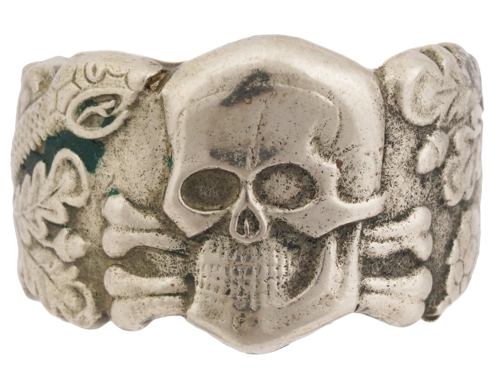 WWII GERMAN ANTI PARTISAN WARFARE TOTENKOPF RING: A WWII Nazi German Third Reich Anti Partisan Warfare Totenkopf 800 silver ring. The exterior of the ring features an engraved Totenkopf skull in the center and snake and oak leave swastika insignia pa