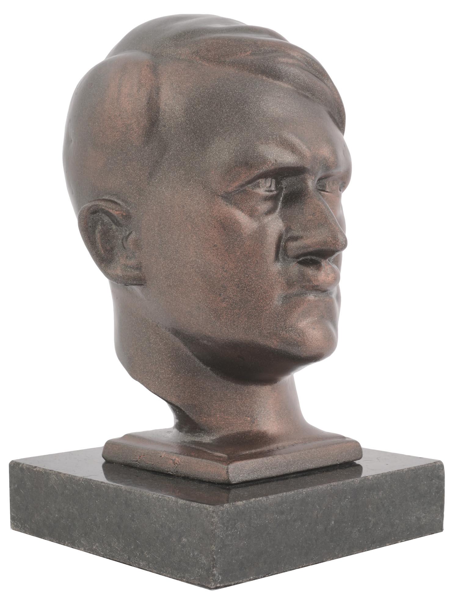 GERMAN BUST OF ADOLF HITLER AFTER HANS RETZBACH: A WWII Nazi German cast iron bust representing Adolph Hitler. The sculpture is mounted on a marble base. After an original artwork by Hans Retzbach, 1888 to 1960, a German sculptor. Adolf Hitler, Germ