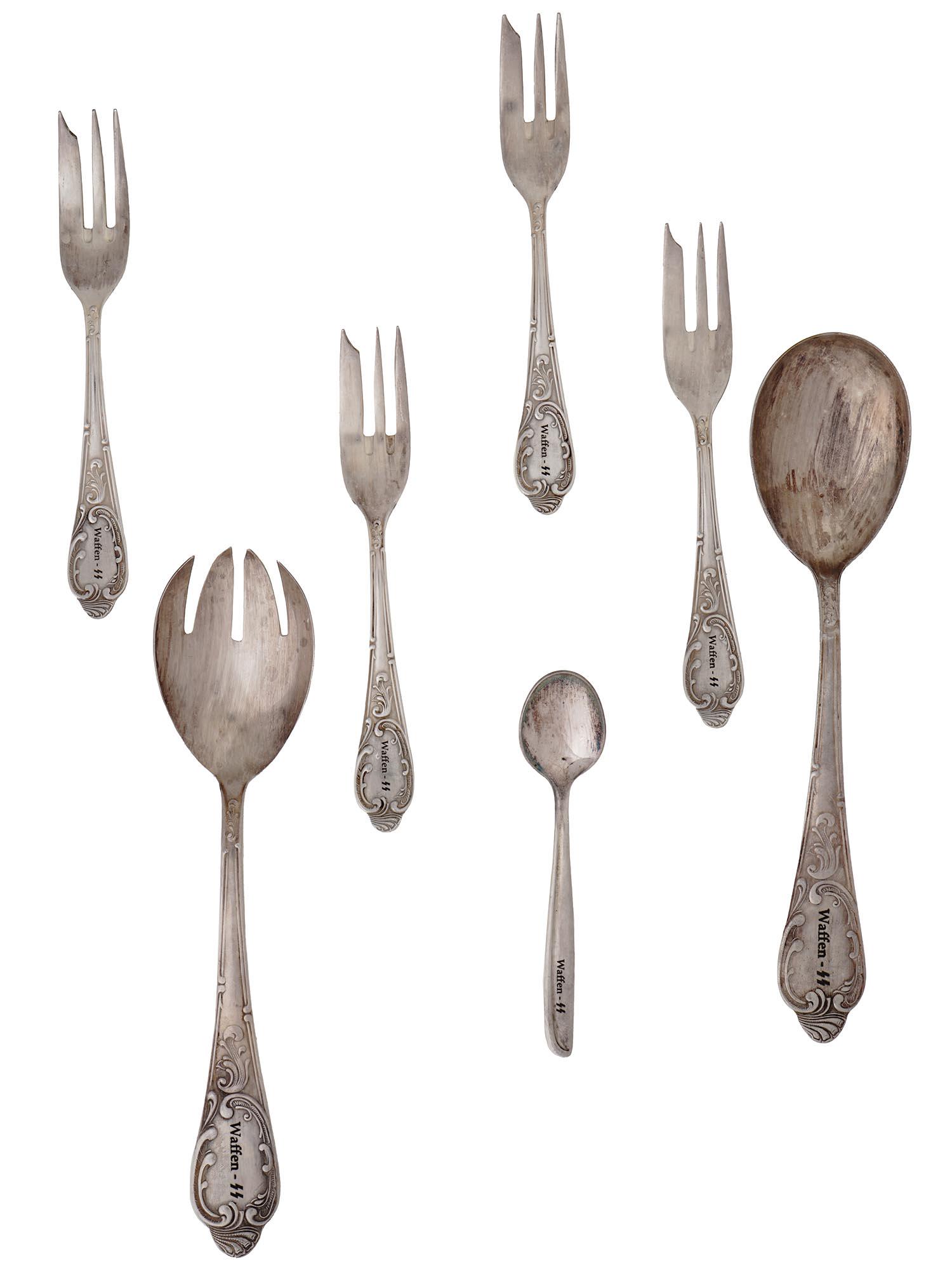 WWII NAZI GERMAN SS TABLEWARE SPOONS ANF FORKS: A set of WWII Nazi German tableware items from a Waffen SS canteen including four fish forks, a serving spoon, a tea spoon, and a dinner spoon. All have marked and decorated handles. WWII Nazi German 
