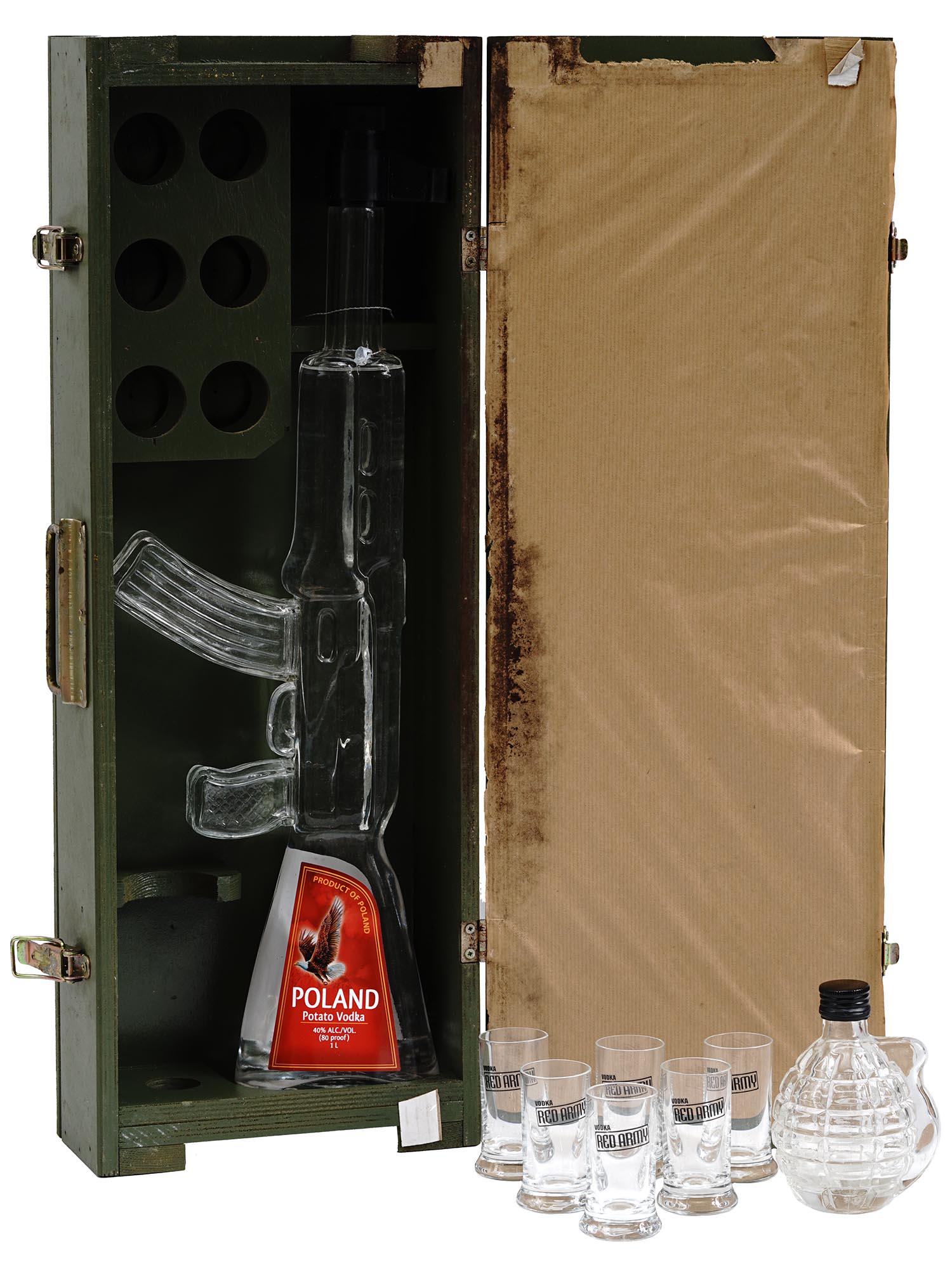 RED ARMY KALASCHNIKOW VODKA SET WITH GLASSES: A Red Army vodka set with a bottle in the shape of a glass replica of the Russian Kalaschnikow assault rifle which is filled with vodka. Product of Poland. Comes with a liqueur grenade in a wooden box