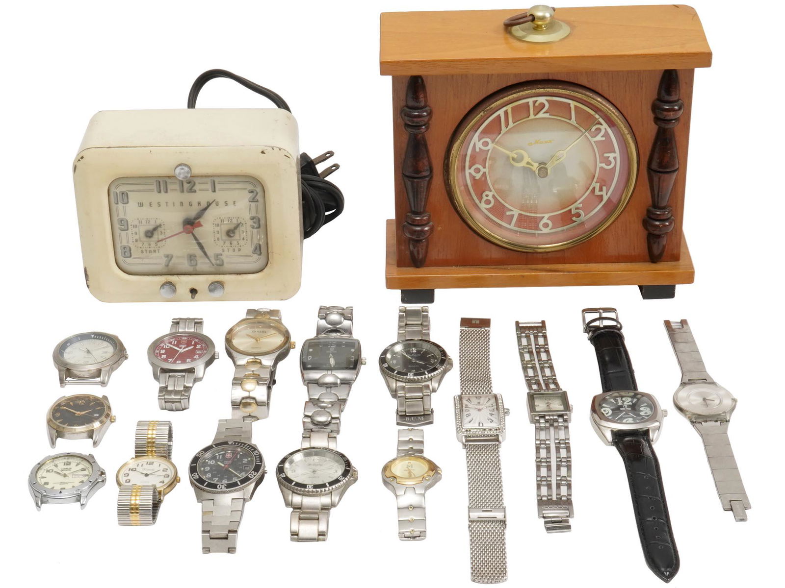 VINTAGE WRIST WATCHES BY TATEOSSIAN QBOS LORUS: A large lot of vintage stainless steel wristwatches. A total of 12 items including watches by Lorus, QBos, Tateossian, Details, Tissot, Xanadu. The lot also includes three separate dials and two mid-c