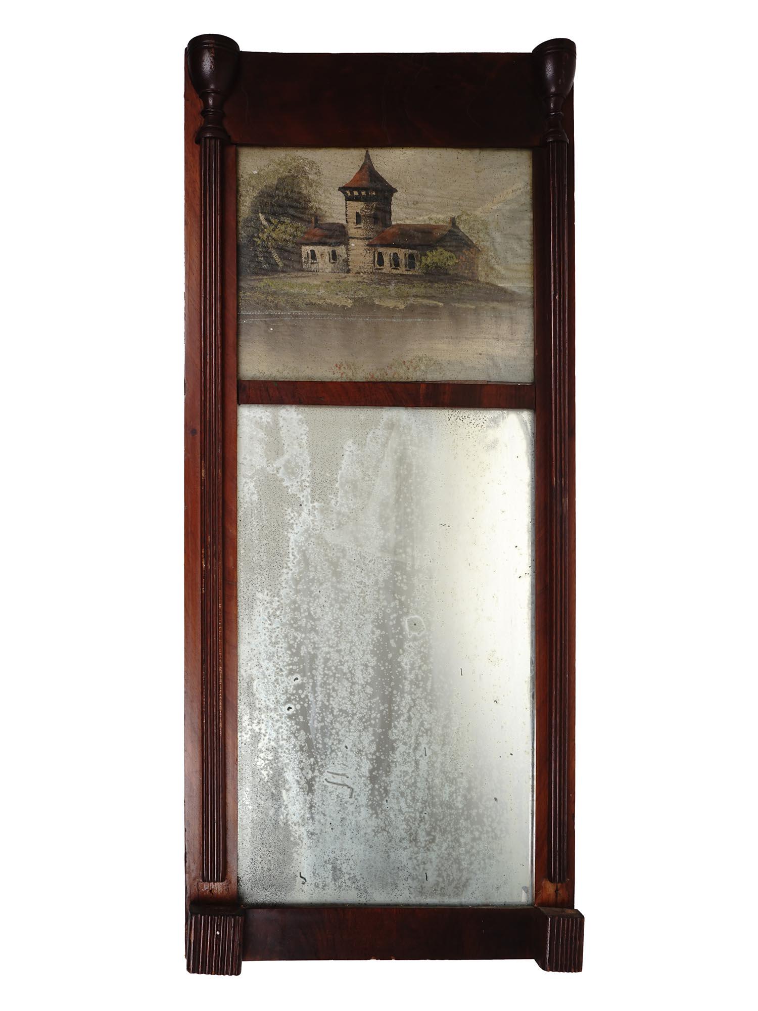 ANTIQUE 1916 WOODEN MIRROR WITH PAINTED LANDSCAPE: An antique Swiss wooden mirror executed circa 1916. The frame of the mirror has carved columns with vases on the sides. The part above the mirror is handpainted with a landscape view of a countryside 