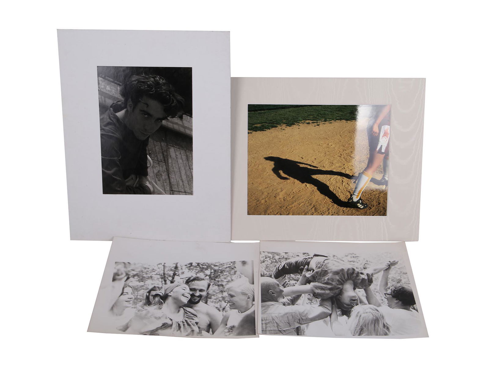 VINTAGE PHOTOS BY CHARLES HENRY LERRIGO: Charles Henry Lerrigo, 1872-1955, was an American doctor and writer. The lot includes one colored and three black and white photographs. Images include a male portrait, a shadow cast by a soccer playe