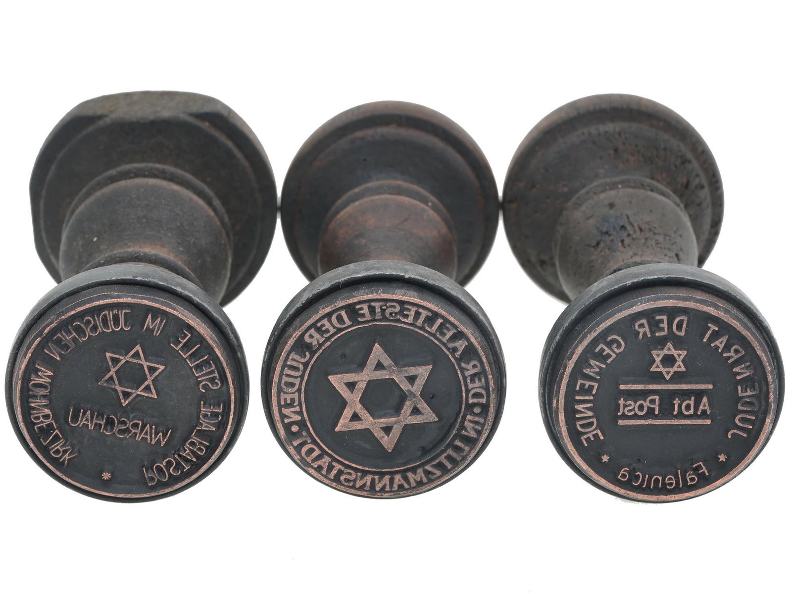 WWII HOLOCAUST JEWISH GHETTO POSTAGE SEALS, 3 PCS: A lot of WWII Polish wooden hand stamps of ghetto administrations. A total of three items. Postablage Stelle im Judischen Wohnbezirk Warschau, Post office in the Jewish residential district of Warsaw.