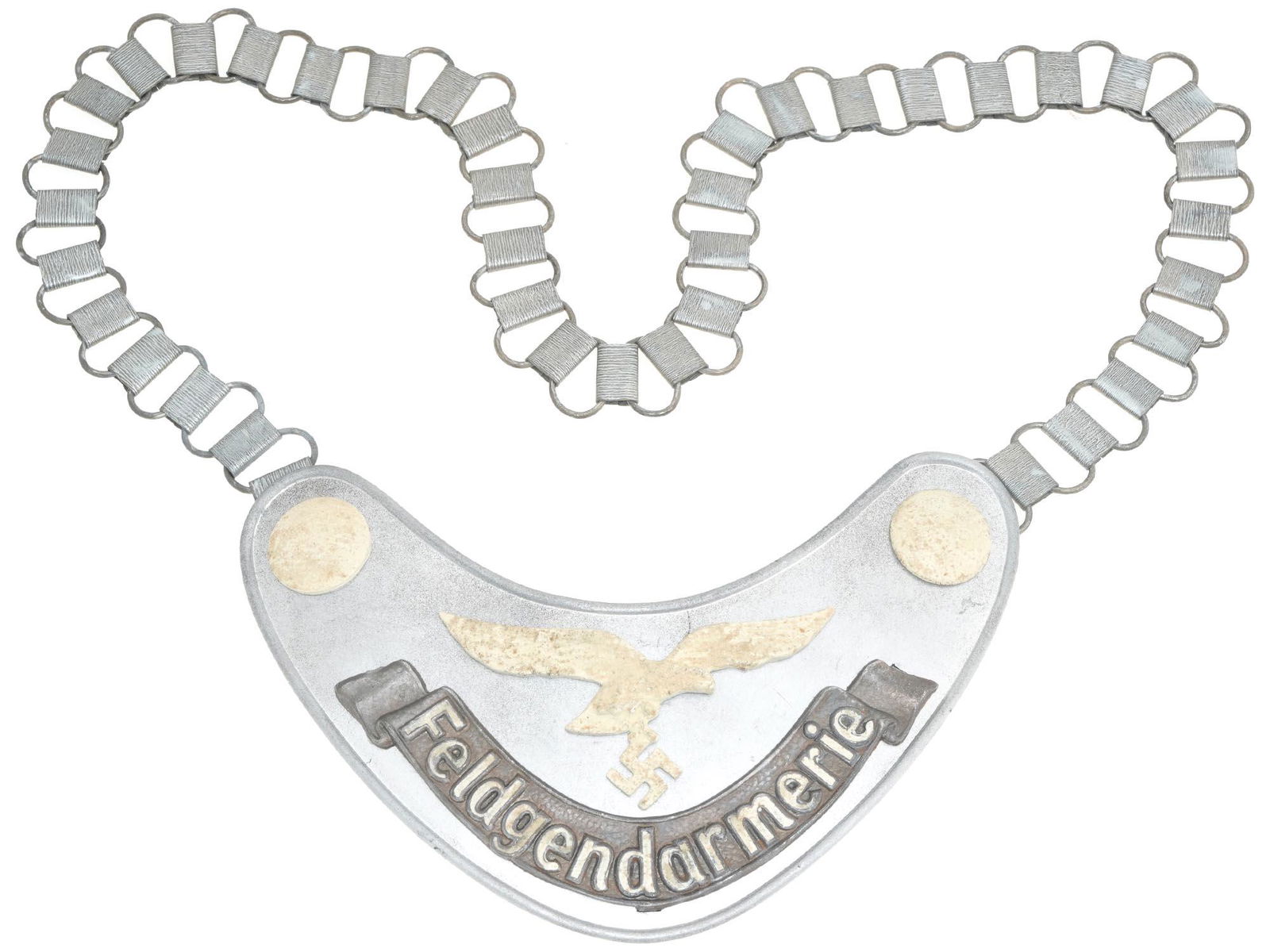 WWII NAZI GERMAN LUFTWAFFE FIELD ZHANDARM GORGET: A World War II Nazi German military insignia, a Luftwaffe field gendarmes gorget with chain. The item bears a golden eagle with swastika and inscription Feldgendarmerie. Marked 1935 is on the backside