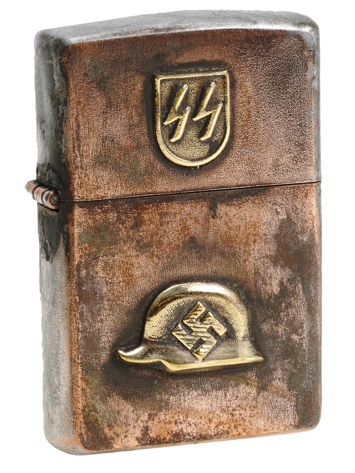 WWII NAZI GERMAN WAFFEN SS CIGARETTE LIGHTER: A World War II Nazi German steel gas lighter. Relief SS emblem decorates the lid, a relief helmet with swastika is on the body of the case. Reichsadler hallmark is on the backside. Second World War Hi