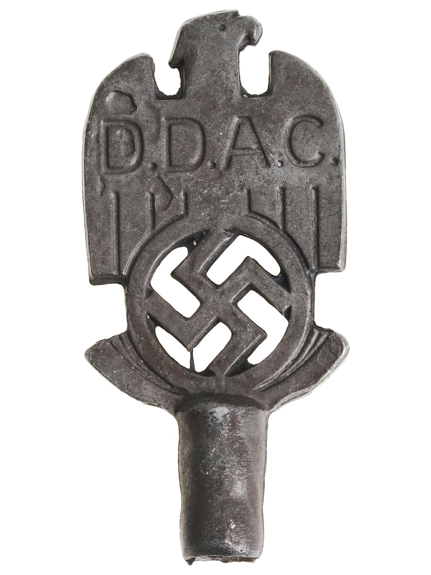 WWII NAZI GERMAN DDAC REICHSADLER FLAG POLE TOP: A World War II Nazi German flag pole top for the DDAC table size flag. The steel finial represents a Reichsadler with swastika and embossed inscription DDAC. DDAC, short for Der Deutsche Automobil-Clu