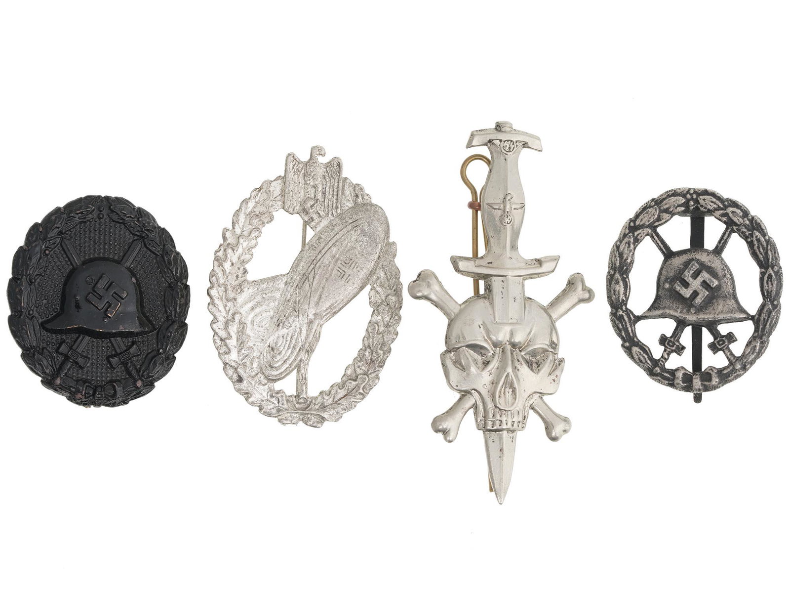 WWII NAZI GERMAN THIRD REICH BADGES, 4 PCS: A group of 4 German WWII badges: Army Balloon Pilot, 2 Wound badges and SS Totenkopf badge. One of the Wound badges is marked on the pin verso: GES. GESCH. Second World War Nazi German Third Reich Bad