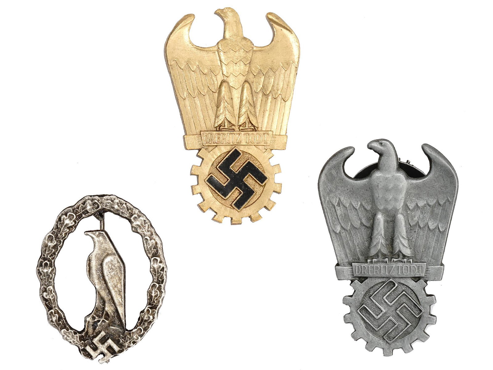 COLLECTION OF WWII NAZI GERMAN THIRD REICH BADGES: A collection of WWII Nazi German Third Reich badges. The collection includes a Luftwaffe Retired Pilot Commemorative badge, the badge features an eagle perched atop a large rock surrounded by a wreath