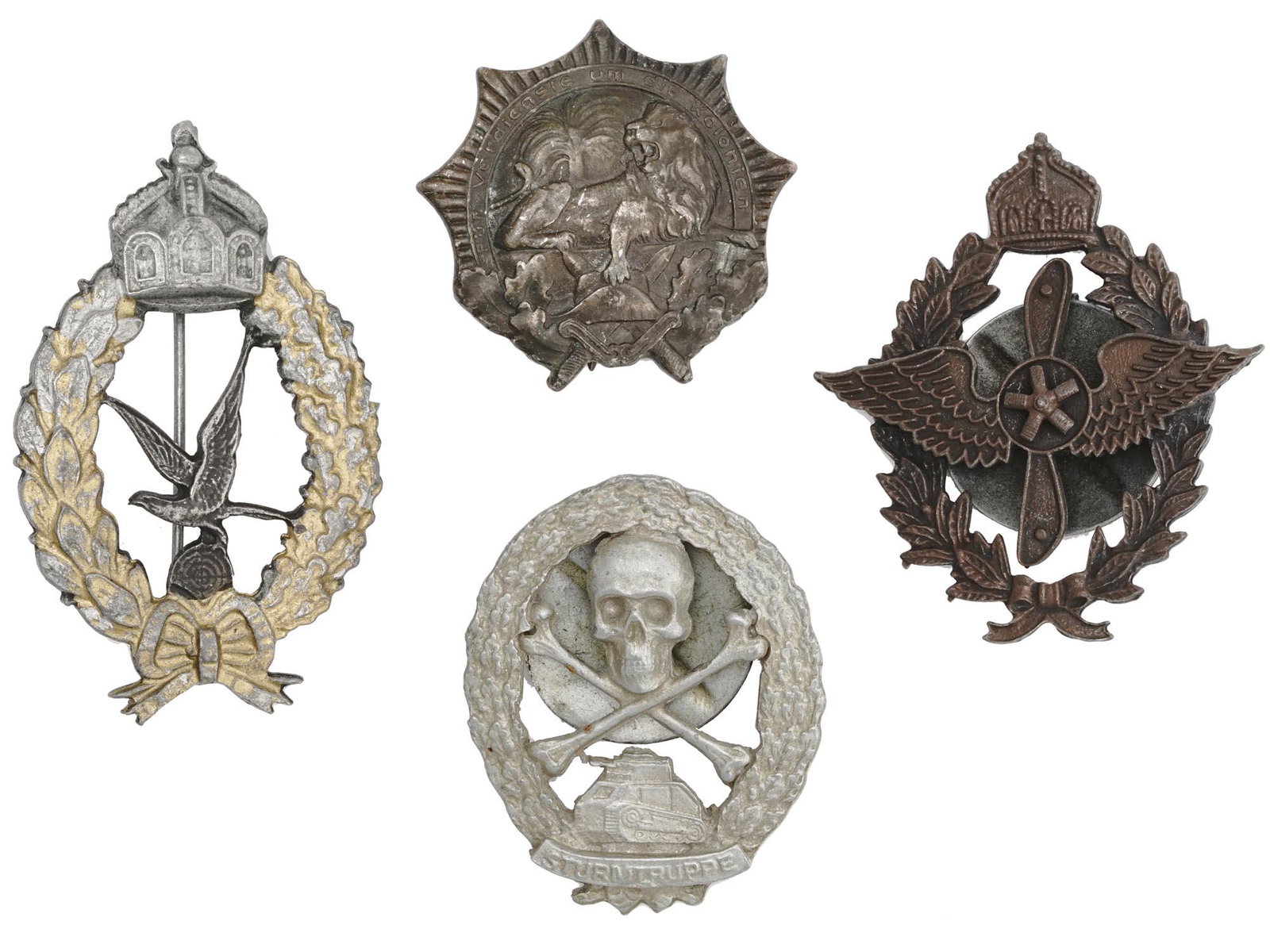 COLLECTION OF WWI IMPERIAL PRUSSIAN GERMAN MEDALS: A collection of WWI Imperial Prussian German medals. The collection includes an Imperial German Naval Gunner Badge; a German silver Colonial Merits badge, the Lion Order, 1st Class pin back, issued in
