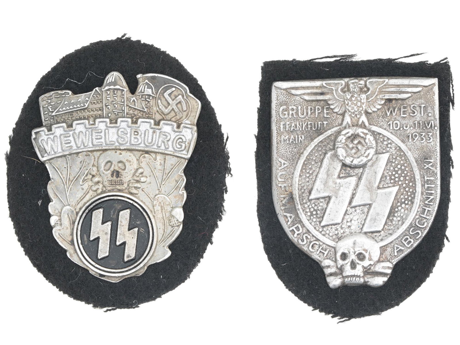 WWII GERMAN NAZI THIRD REICH MILITARY PIN SHIELDS: A pair of WWII German Nazi Third Reich Military metal pin shields. The first: a Waffen SS Academy Wewelsburg black enameled shield, adorned with an image of a castle at the top with a skull in the cen
