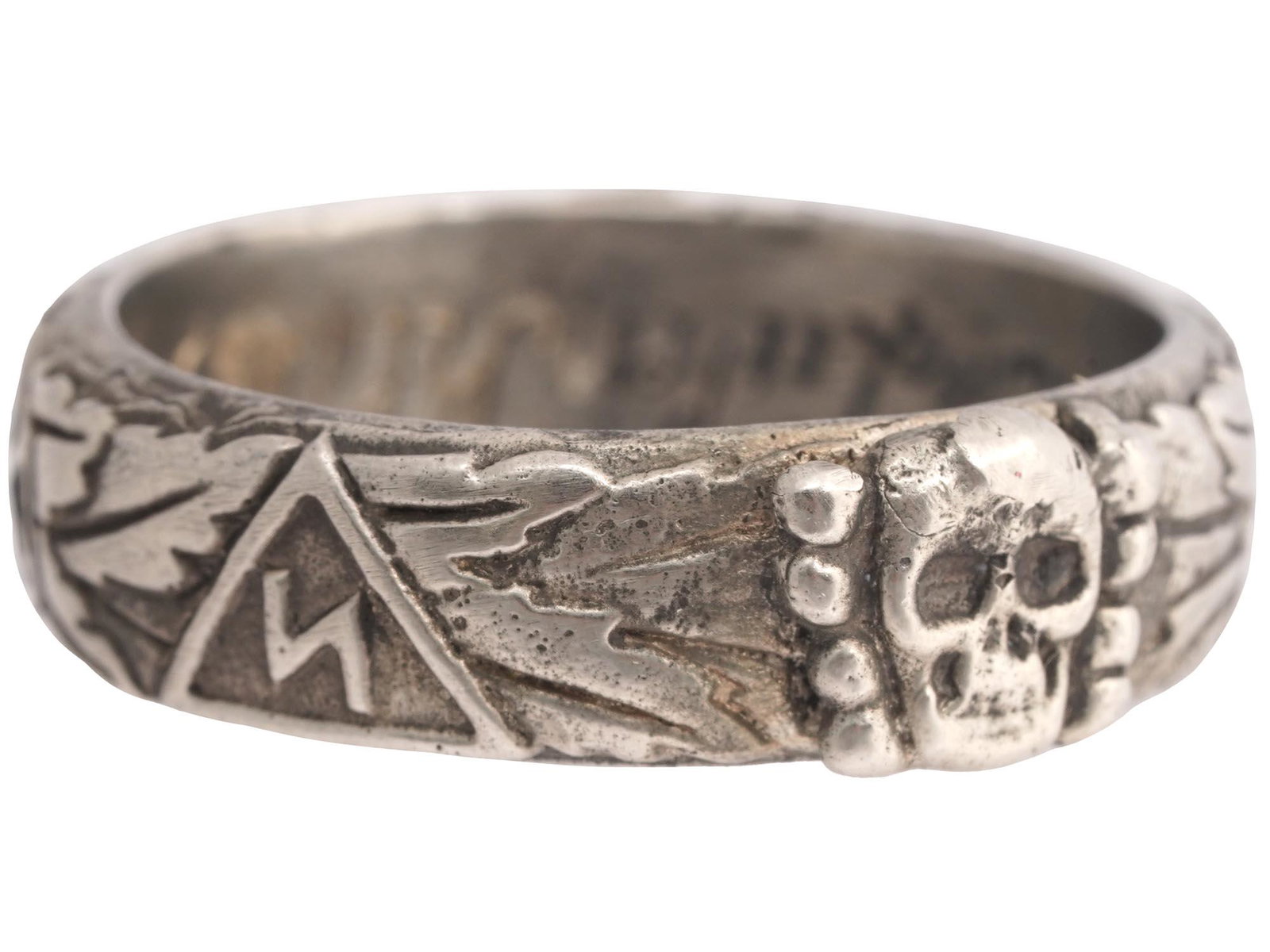 WW2 NAZI GERMAN THIRD REICH SS HIMMLER HONOR RING: A WWII Nazi German Third Reich SS Himmler Honor, probably silver, ring. The exterior of the ring is engraved with oak leaves and swastika insignia patterns, and a Totenkopf swastika insignia in the ce