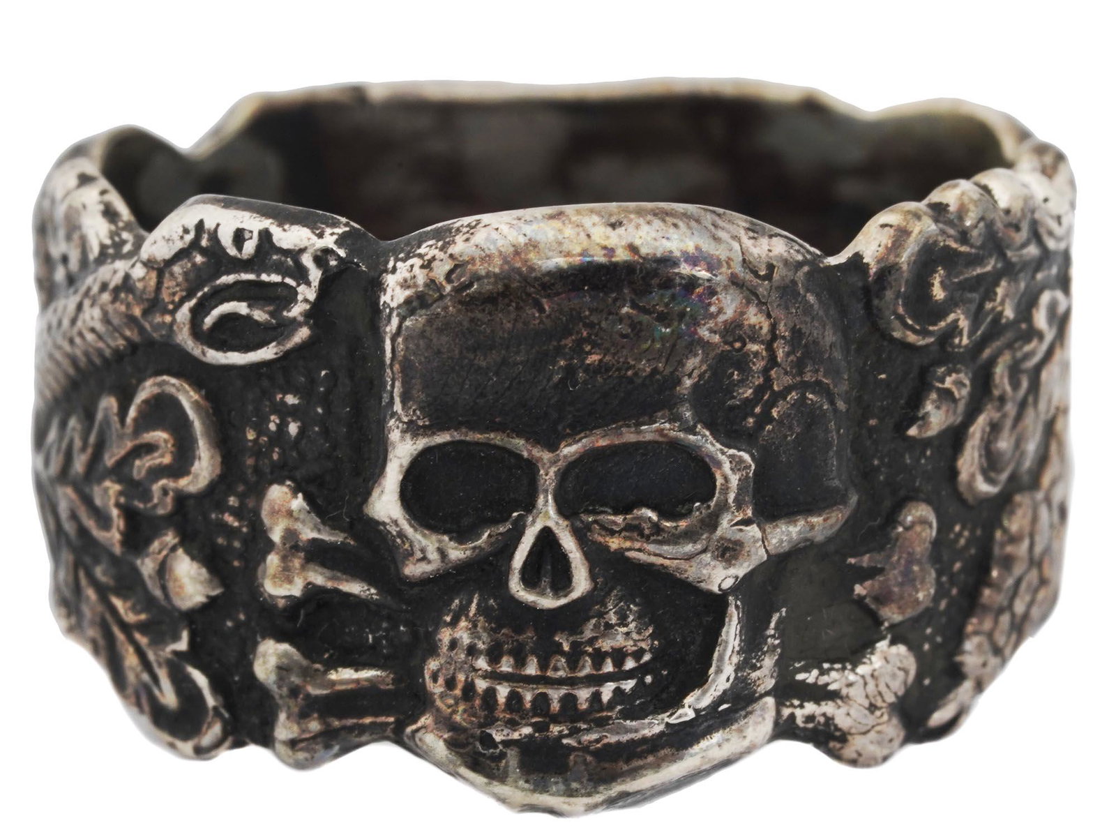 NAZI GERMAN WWII SS ANTI-PARTIZAN OFFICER RING: A Nazi German WWII Waffen SS Anti-Partizan officer relief silver ring featuring an image of a skull with oak leaves and a serpent to the sides. Marked inside and numbered. Weight: 10 grams. Nazi Germa