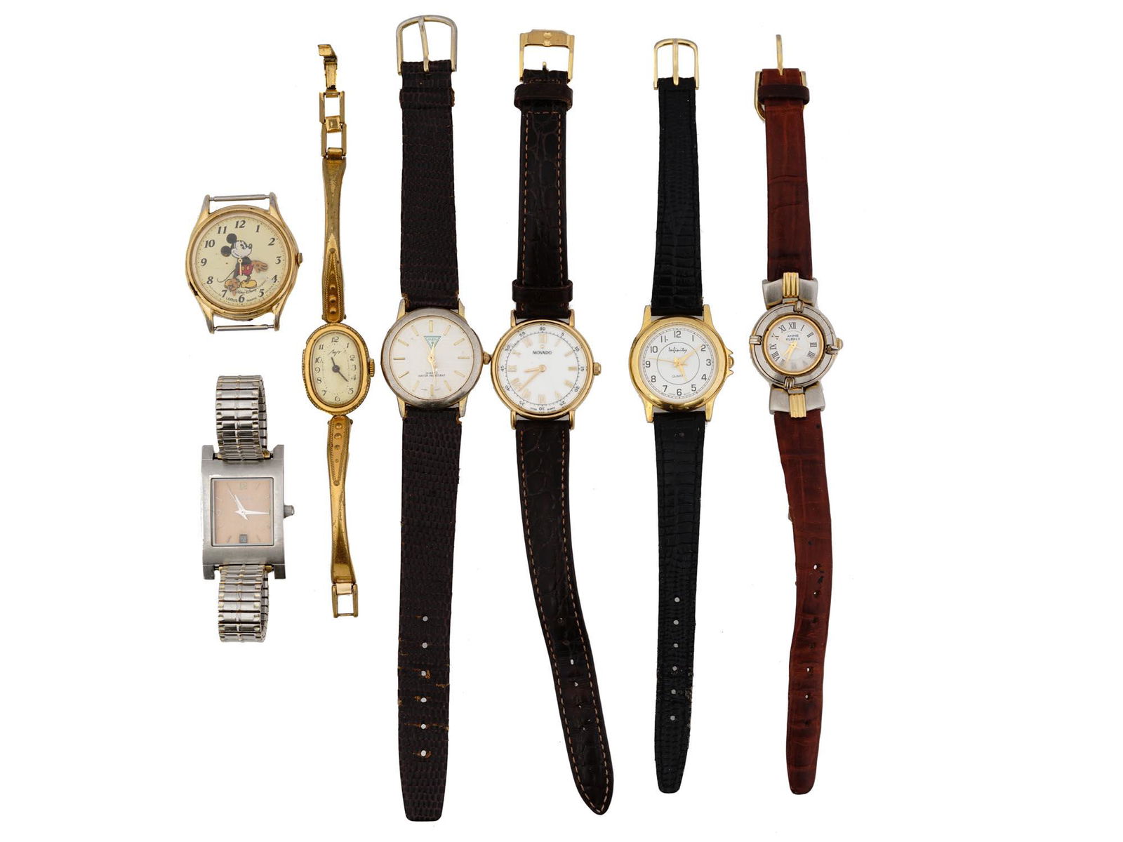 VINTAGE WRIST WATCHES BY GUESS LUCH MOVADO FOSSIL: A lot of vintage stainless steel wristwatches with leather and link bracelets. A total of 7 items including watches by Movado, Luch, Guess, Anne Klein, Fossil. The lot also includes a separate Walt Di