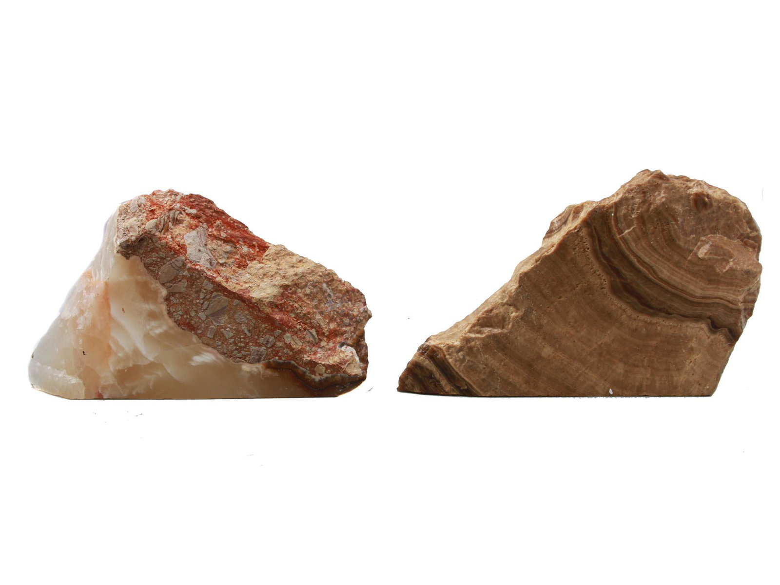 TWO BRUTALIST ONYX FREEFORM ASHTRAYS: Two brutalist onyx ashtrays or storage compartments of a stone with vivid veining. The recessed portion is polished while the rest of the surface is left rough. Very heavy. Dimensions: One 8 1/4" in L