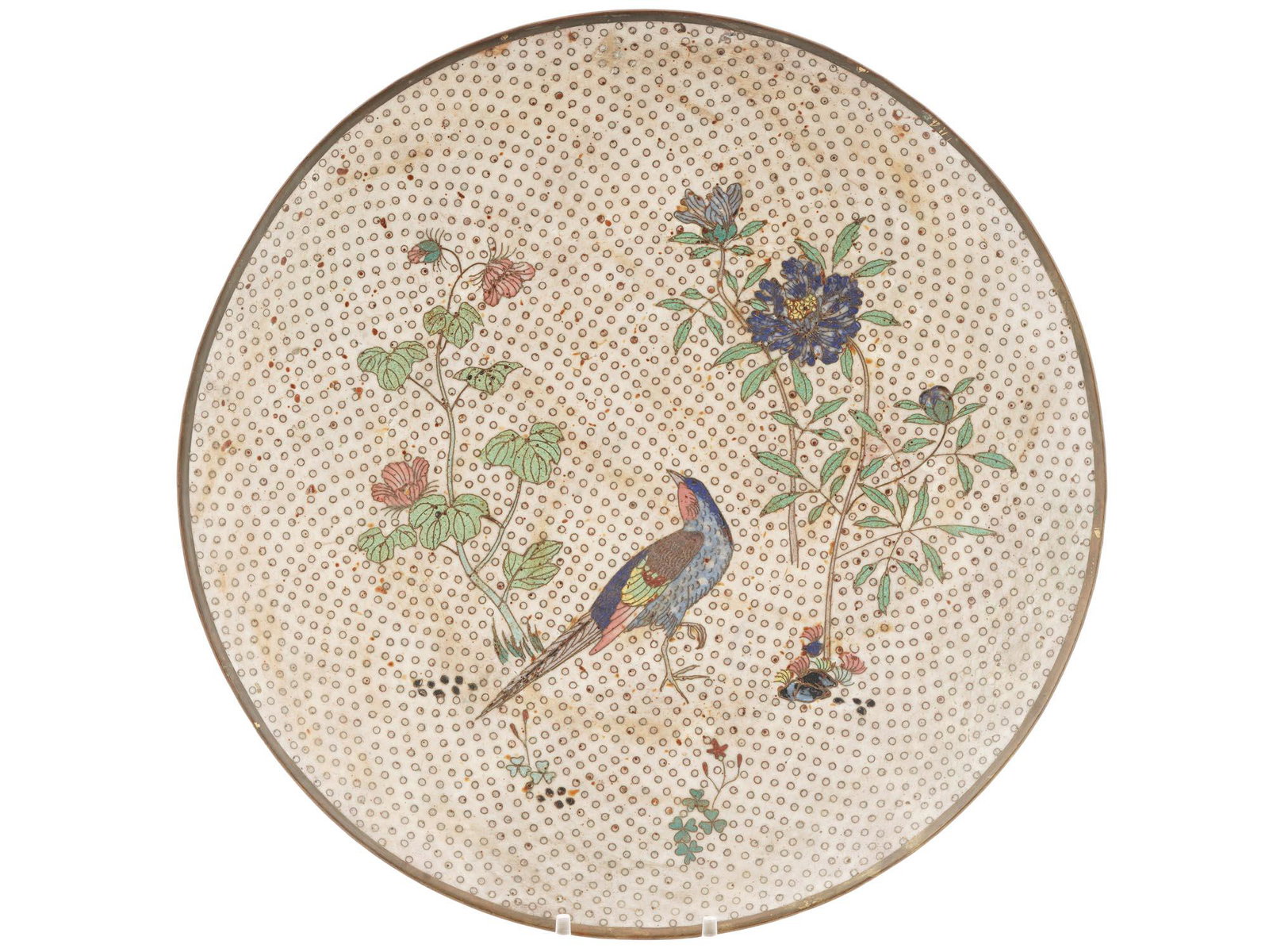 ANTIQUE MEIJI ERA JAPANESE CLOISONNE ENAMEL PLATE: An antique Chinese Meiji era enamel metal plate. Circa: late 19th century to early 20th century. The plate is enameled with a polychrome scene depicting a bird in blossoming sakura flowers made in the