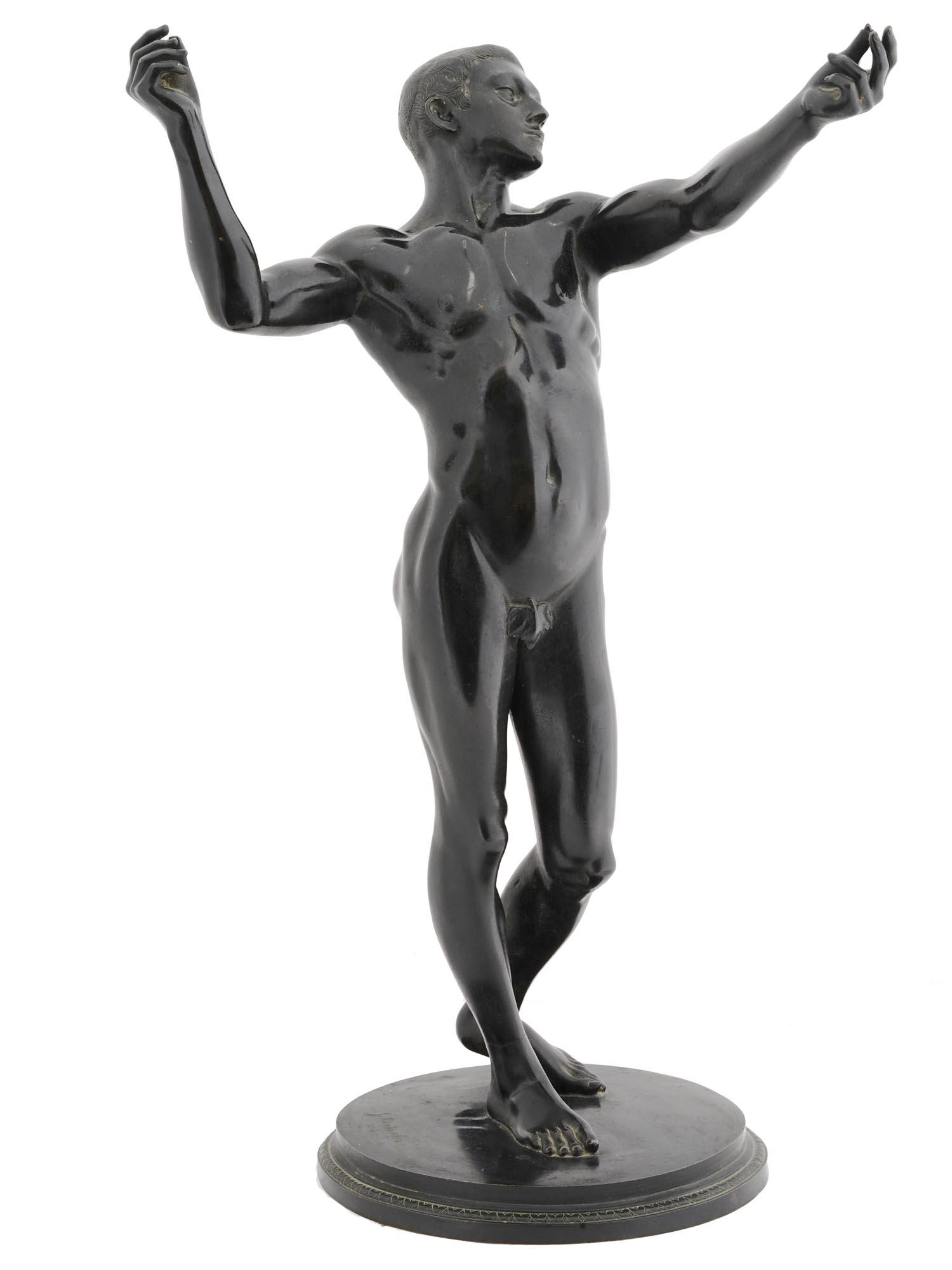 BRONZE SCULPTURE YOUNG MAN BY JOSEF HINTERSEHER: Josef Hinterseher, German, 1873 to 1955, bronze sculpture depicting a nude young man in full height with his hands up. Signed to the base. Circa the early mid 20th century. At a relatively young age h