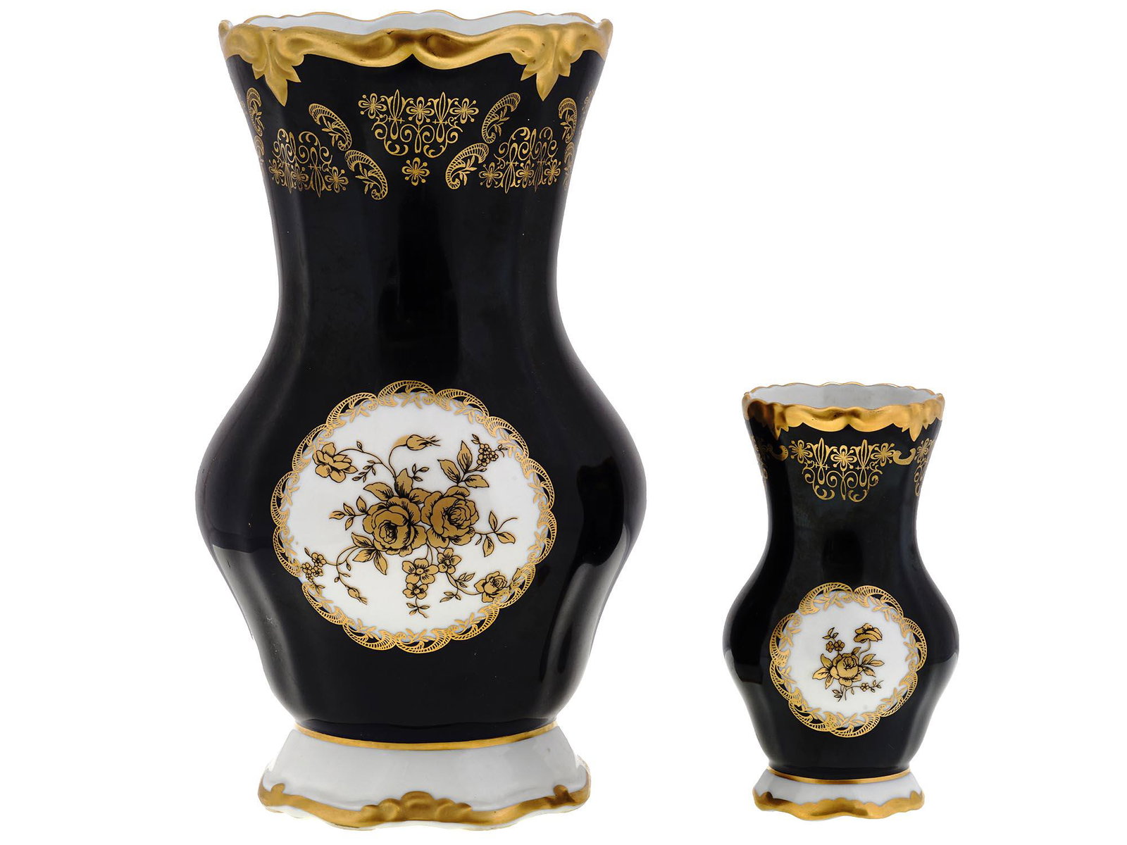 GDR WEIMAR PORZELLAN GILT BLACK PORCELAIN VASES: A pair of mid-20th century East German porcelain vases by Weimar Porzellan, one of the oldest German porcelain manufactures. Matching vases of various size, black bodies with gilt ornaments and rose f