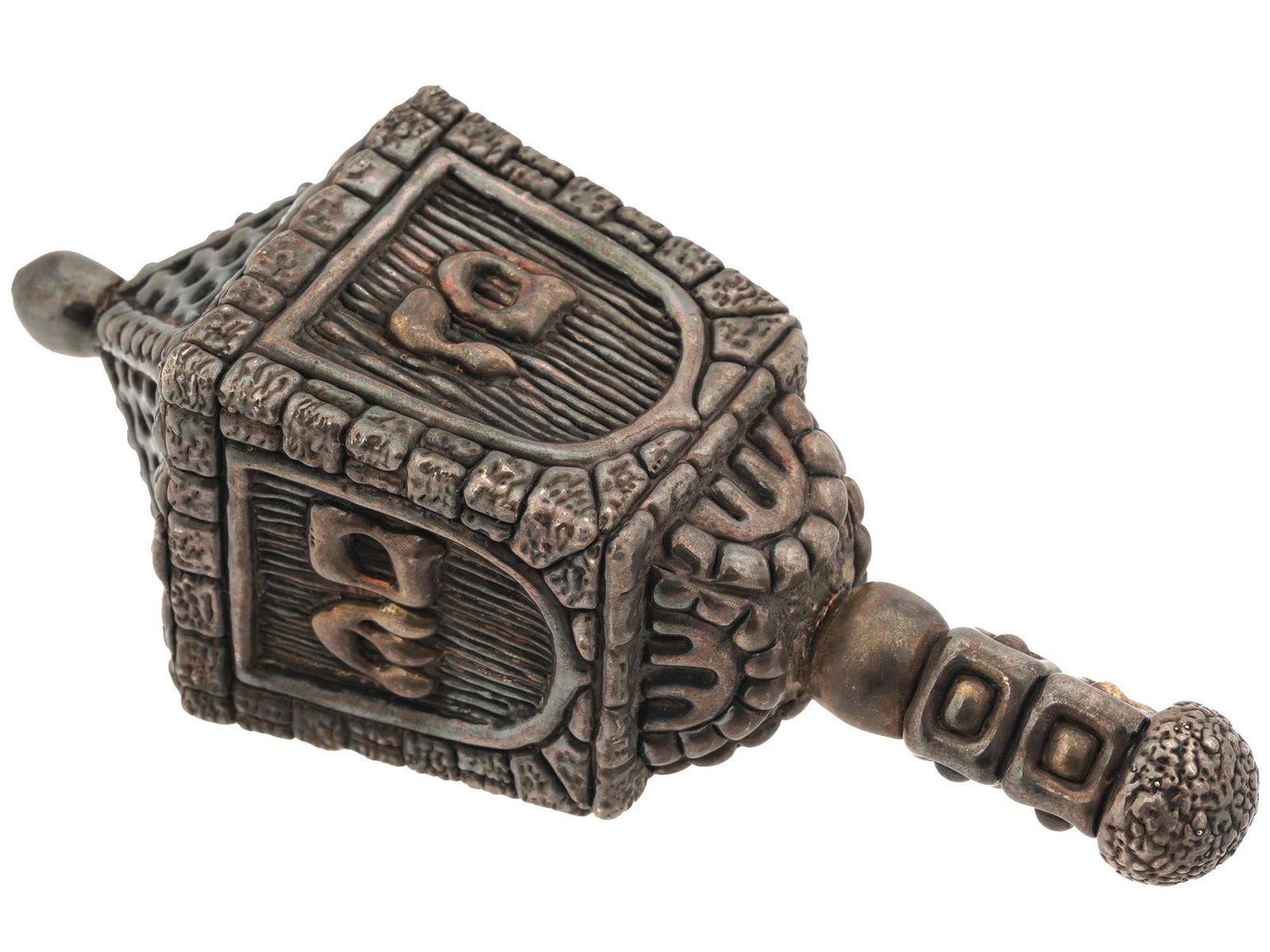 JERUSALEM ELECTROFORM 925 SILVER DREIDEL SEVIVON: A vintage sterling silver Judaica dreidel created using the electroforming process. The surface is decorated as a relief masonry with inscriptions in Hebrew. Hallmarked with a 925 silver standard. Cir
