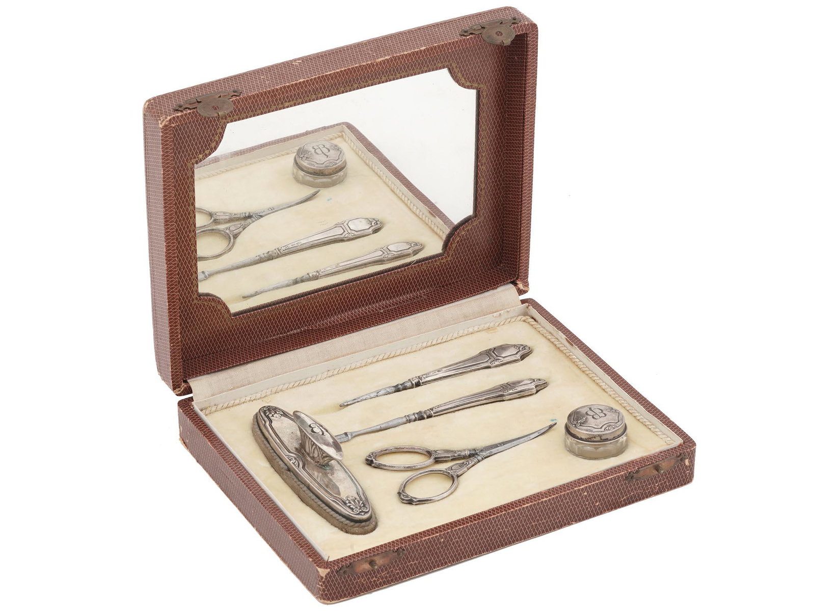 WWII EVA BRAUN MONOGRAMMED MANICURE SET, 5 PCS: A World War II German sterling silver manicure set in original box. The set includes a pair of manicure scissors, a trimmer, a polissoir, a nail file, and a glass cream box. The pieces has embossed de