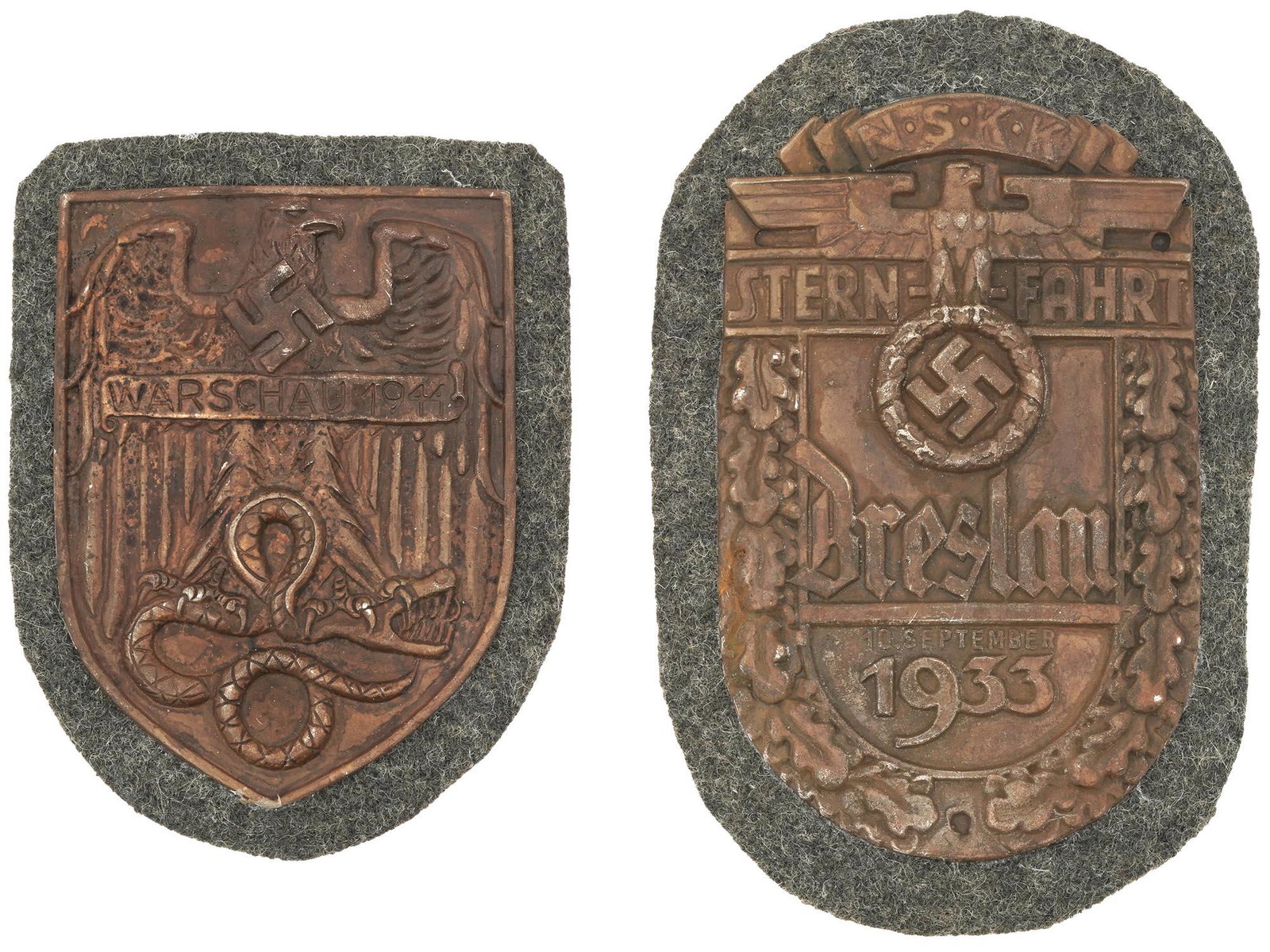 WWII NAZI GERMAN WARSAW AND NSKK BRESLAU SHIELDS: A pair of World War II German decorations, the Warsaw Shield and the NSKK Breslau Shield. The Warsaw Shield feature an eagle standing on a snake and inscription Warsaw 1944. The Breslau Shield depicts