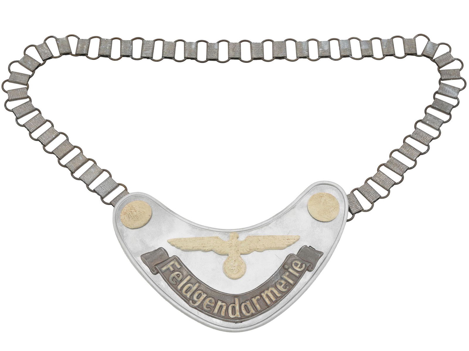 WWII NAZI GERMAN MILITARY FIELD POLICE GORGET: A WWII Nazi German Army Military Field Police Feldgendarmerie gorget of a die stamped steel construction aluminum coated, while the army eagle and buttons are painted with radium paint. The lettering