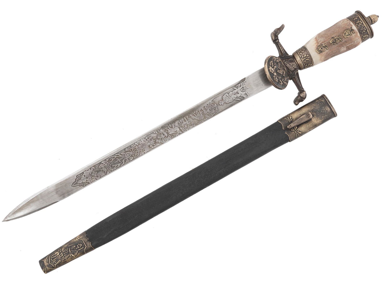 WWII NAZI GERMAN WAIDMANNSHEIL HUNTING DAGGER: A finely manufactured WWII Nazi German hunting dagger featuring a double-edged blade with the etched lettering Waidmannsheil on the recto side, and trees and animals on the verso side. A down-turned s