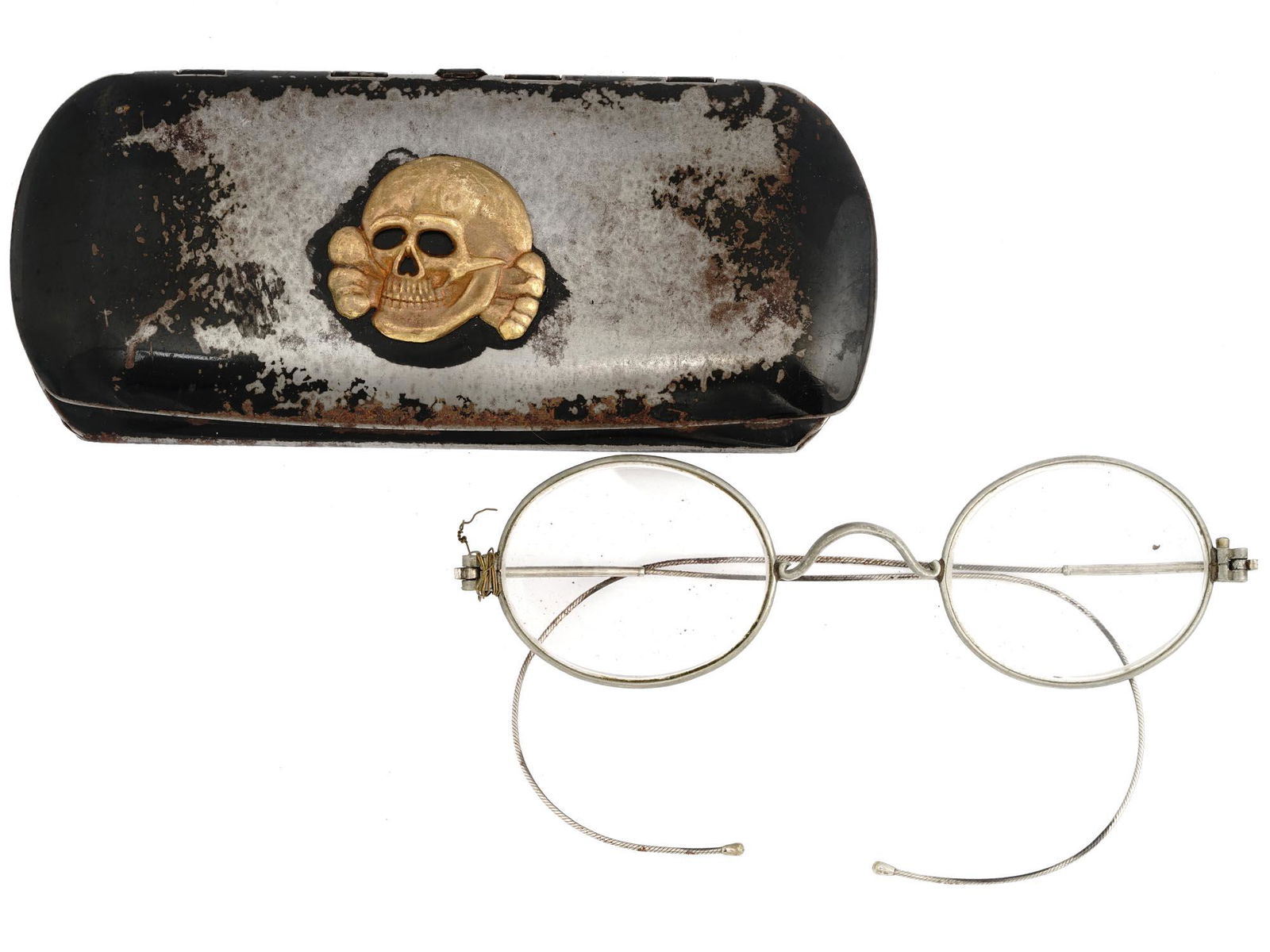 WWII GERMAN NAZI WAFFEN SS TOTENKOPF GLASSES CASE: A WWII Nazi German Third Reich Waffen SS Totenkopf glasses with a case. The exterior of the case is adorned with a gilt metal plaque depicting a skull Totenkopf swastika insignia. WWII Era German Nazi