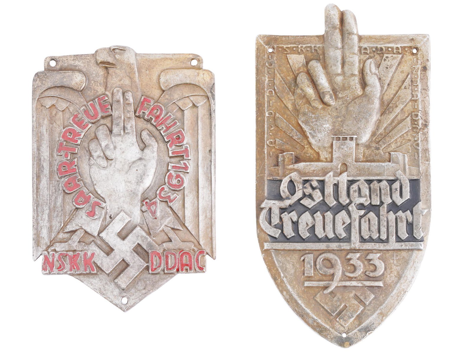 WWII GERMAN THIRD REICH OSTLAND METAL PLAQUES: Two WWII Nazi German National Socialist Motor Corps and German Automobile Association commemorative plaques for a driving event rally held in Ostland East Prussia in 1933, and 1934 NSKK DDAC Saar Loya