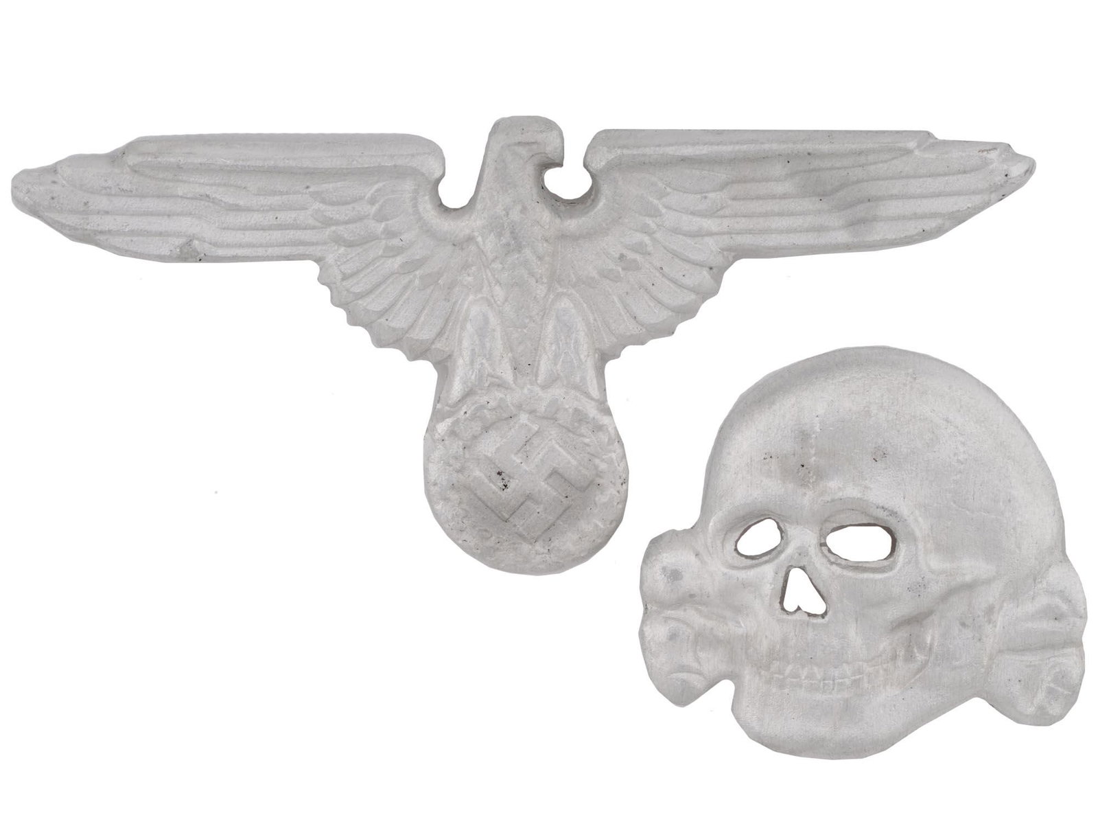 NAZI GERMAN WWII CAP BADGE SET FOR SS VISOR HAT: A Nazi German WWII cap badge set for a SS visor hat consisting of a cap skull and a eagle. Hallmarked. Nazi German WWII Era Third Reich Military Cap Badge Collectibles. Dimensions: Average 2 3/4 X 1 1