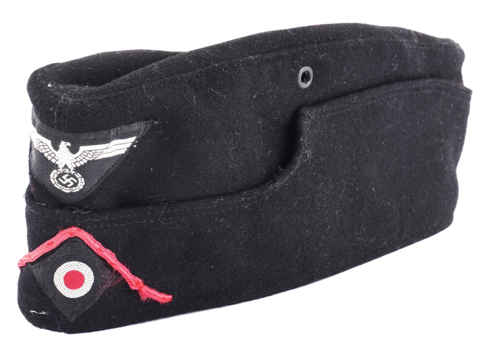 WWII NAZI GERMAN MILITARY WEHRMACHT M38 PANZER CAP: A 1940s Nazi German black wool forage cap. Eagle with swastika and insignia of tank forces, Wehrmacht Panzer division, are on the front. Model M38. Tag inside: 1940 Robert Lubstein Berlin No. 55, Size