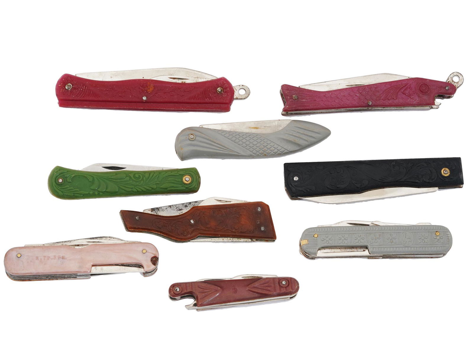 VINTAGE POCKET KNIVES IN PLASTIC CASES: A collection of nine pocket knives in plastic cases decorated in different colors with various sets of tools. Some knives are of the Swiss Army type. Circa the 1960s. Vintage Pocket Knives For Collect
