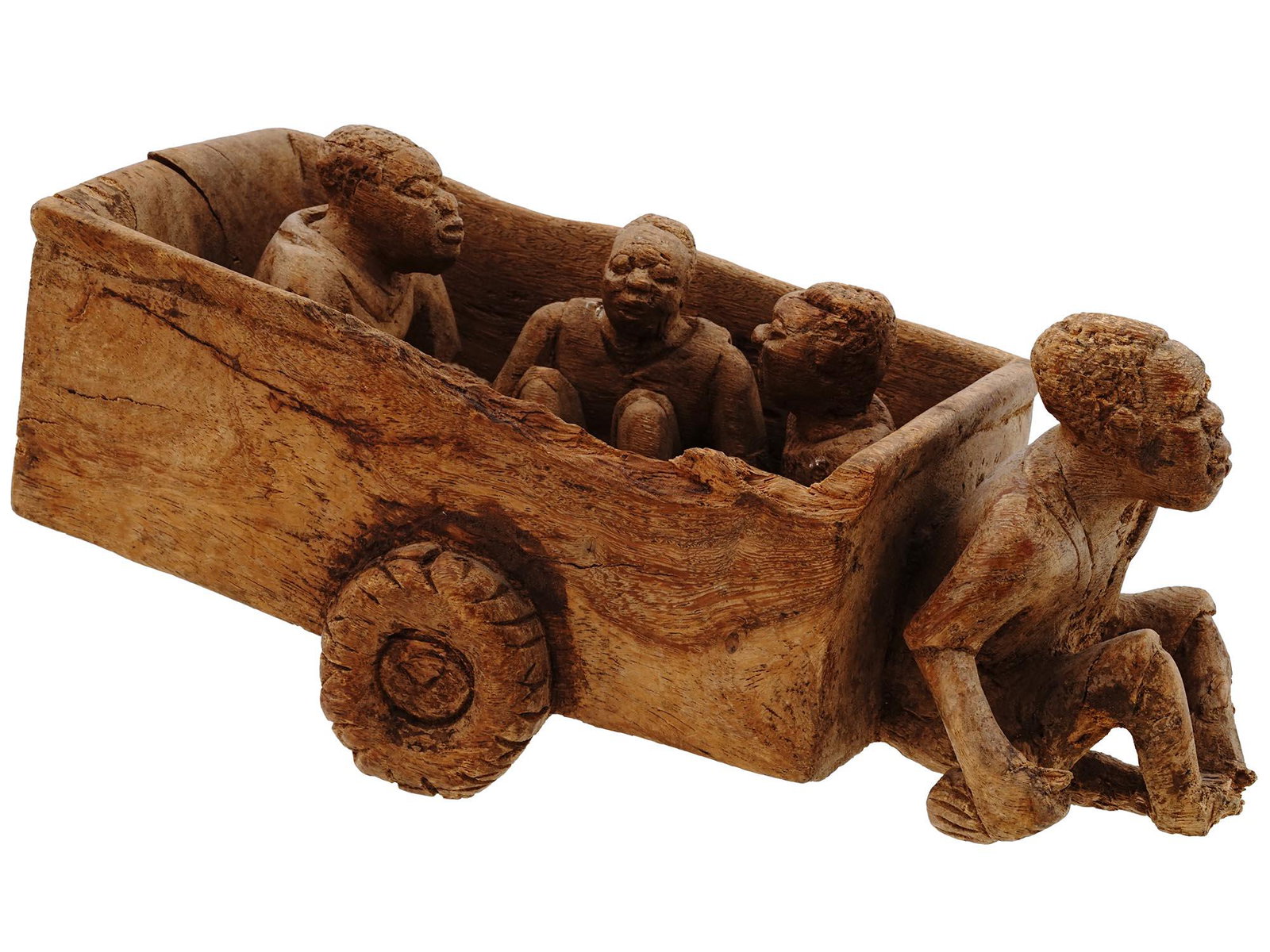 CENTRAL AFRICAN CARVED WOODEN CARRIAGE FIGURE: A mid-20th century Central African wood carving. Presumably of Zanzibar origin. The item represents a man hauling a wagon with people. The wheels of the cart are movable. Collectible African Tribal Ap