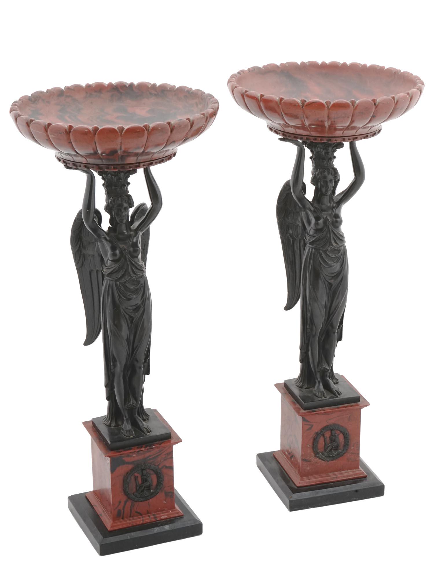 ANTIQUE FRENCH EMPIRE GRAND TOUR ANGEL TAZZAS: A pair of antique French Empire Grand Tour tazzas. Crafted with exceptional attention to detail, each tazza features a beautifully carved stone bowl held aloft by the hands of a graceful angel. The in