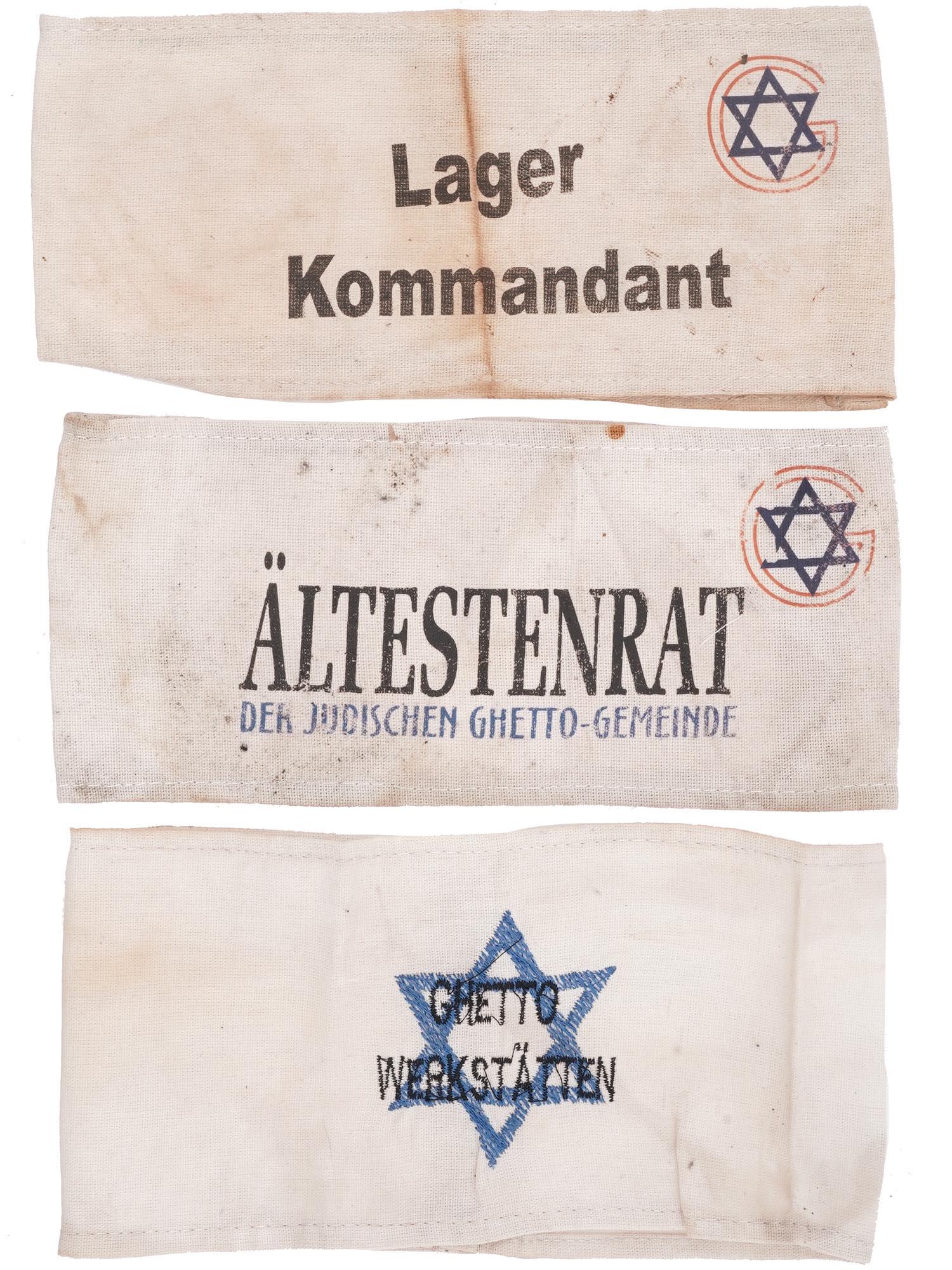 WWII HOLOCAUST CONCENTRATION CAMP ARMBANDS, 3 PCS: A lot of three World War II Jewish concentration camp fabric armbands. The first has a hand-emboridered Magen David and inscription Ghetto Werkstatten, Ghetto Workshops. The second has a Magen David w