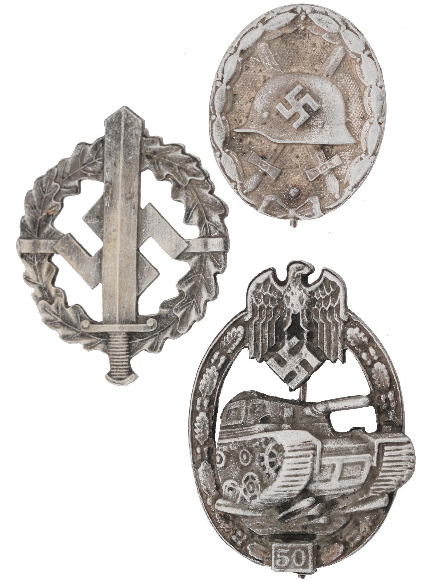 WWII NAZI GERMAN MILITARY ASSAULT BADGES, 3 PCS: A lot of World War II Nazi German military decorations. A total of 3 award badges: Army Tank Assault badge for participating in 50 assaults, SA sport award, wound badge. Second World War Historical Co