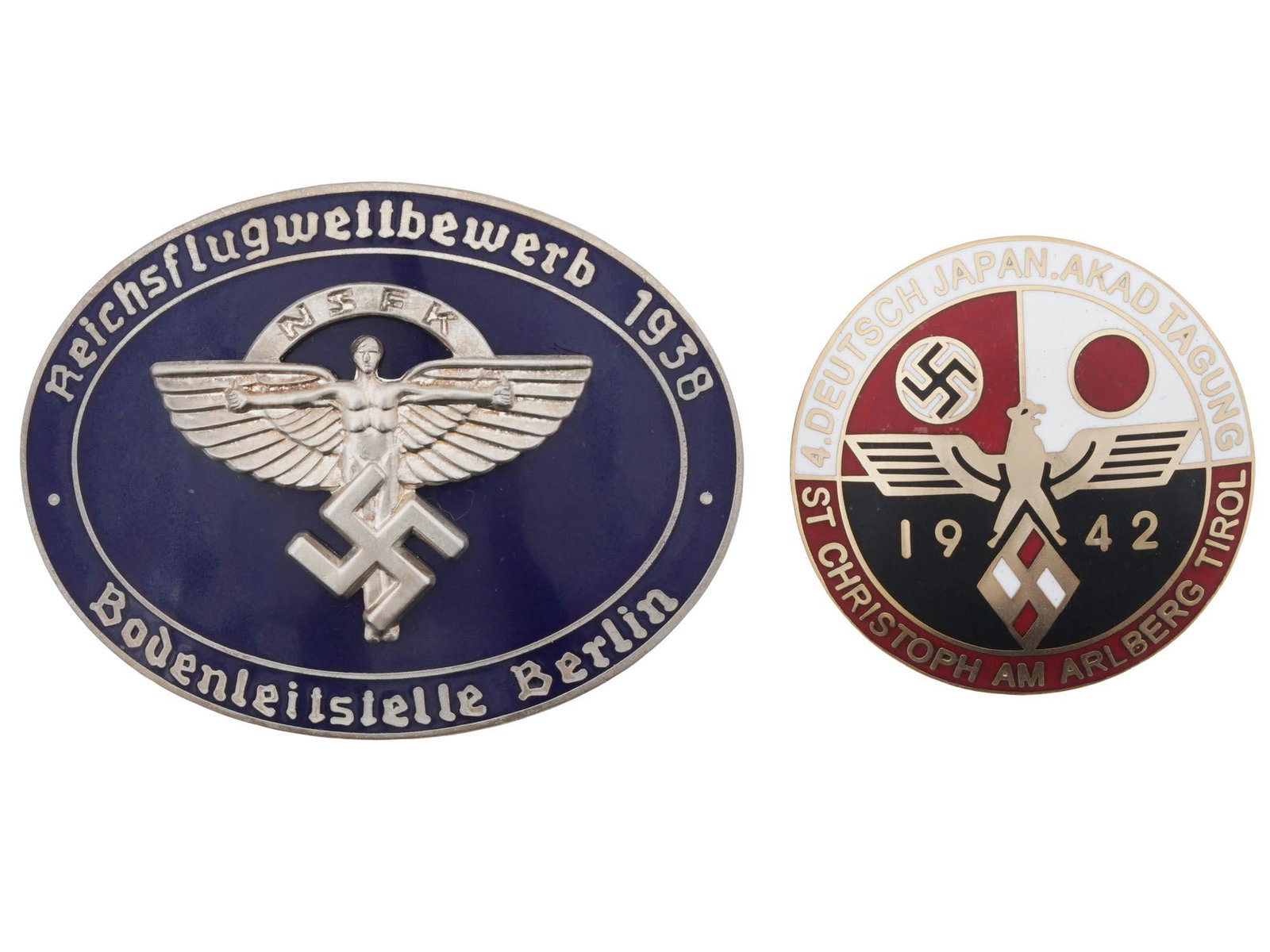 COLLECTION OF WWII NAZI GERMAN THIRD REICH BADGES: A collection of two WWII Nazi German Third Reich badges. The first: a 1939 NSFK pilots Championship badge, made in an oval form, covered with enamel in a navy blue shade, adorned with a relief of a ma