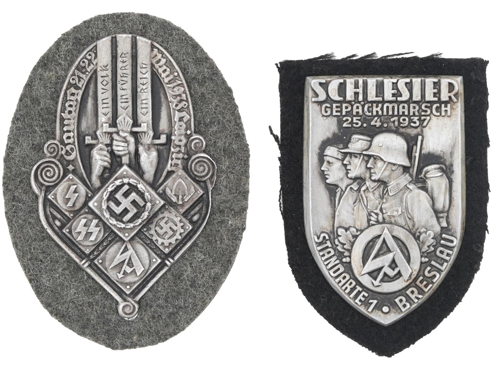 WWII GERMAN NAZI THIRD REICH MILITARY PIN SHIELDS: A pair of WWII German Nazi Third Reich Military metal pin shields. The first is a Gautag Leipzig Organizations badge with engraved swastika insignias. The second is a Silesian baggage march standard B