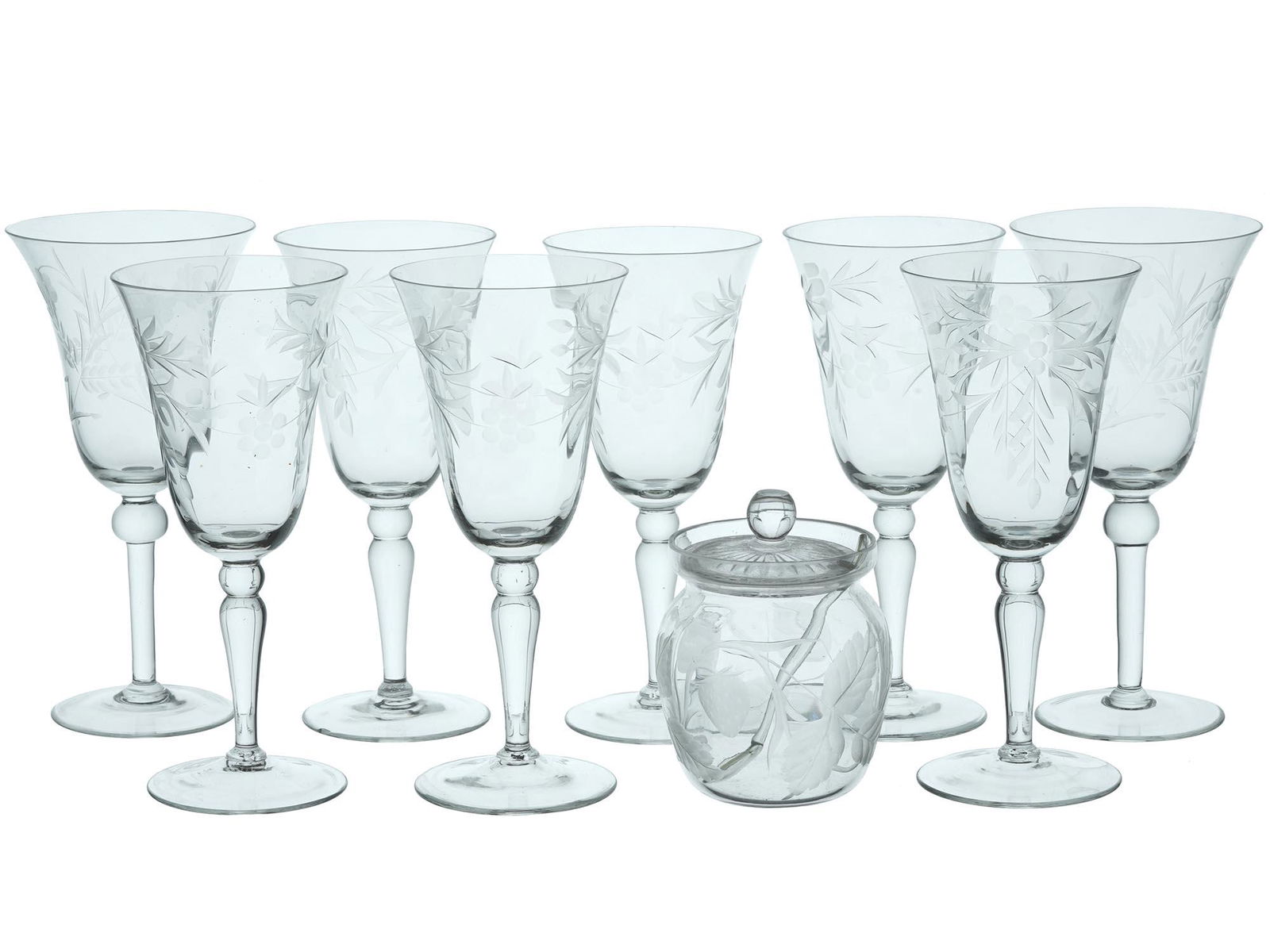 ETCHED CRYSTAL WINE GLASSES, SUGAR BOWL AND SPOON: A set of vintage light blue crystal glassware, a total of 8 wineglasses and a lidded sugar bowl with matching spoon. The pieces are decorated with etched flowers and berries design. Vintage Elegant Gl