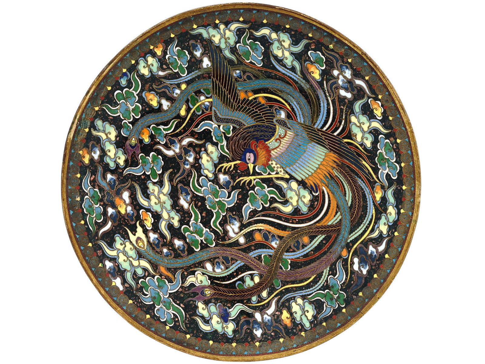 ANTIQUE JAPANESE ENAMELED PHOENIX CHARGER: An antique Japanese Meiji period cloisonne enameled charger decorated with multicolored floral designs with a phoenix bird in the center. Features gilt rims and wire ornamentations to the back. Dates 