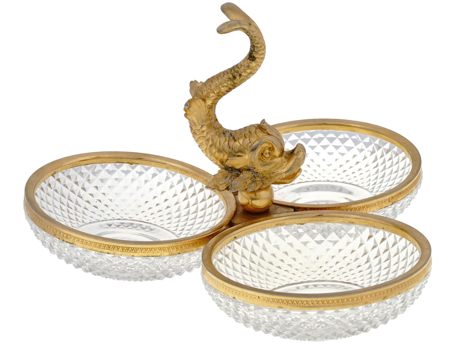 FRENCH EMPIRE GILT BRONZE AND CRYSTAL TRIPLE BOWL: An antique 19th-century French triple cut crystal serving bowl on gilt bronze stand. The figurative holder in the center represents a dolphin. Collectible Neoclassical Tableware And Serveware, Glasswa
