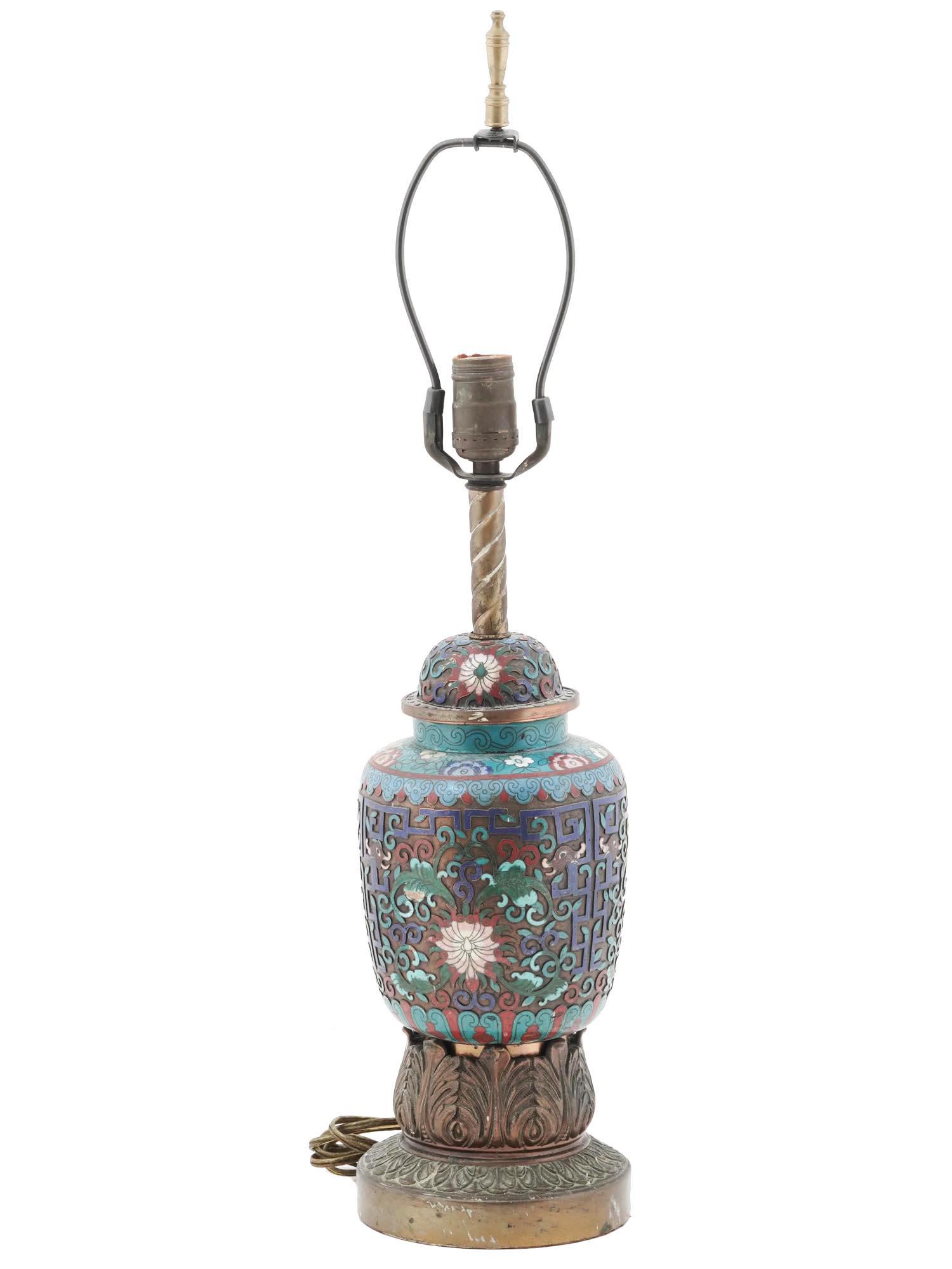 ANTIQUE CHINESE CLOISONNE ENAMEL AND BRASS LAMP: An antique Chinese brass and enamel lamp. Circa: early 20th century. The base is enameled with polychrome floral, foliage and scrollwork patterns made in the Cloisonne technique. The base is adorned w