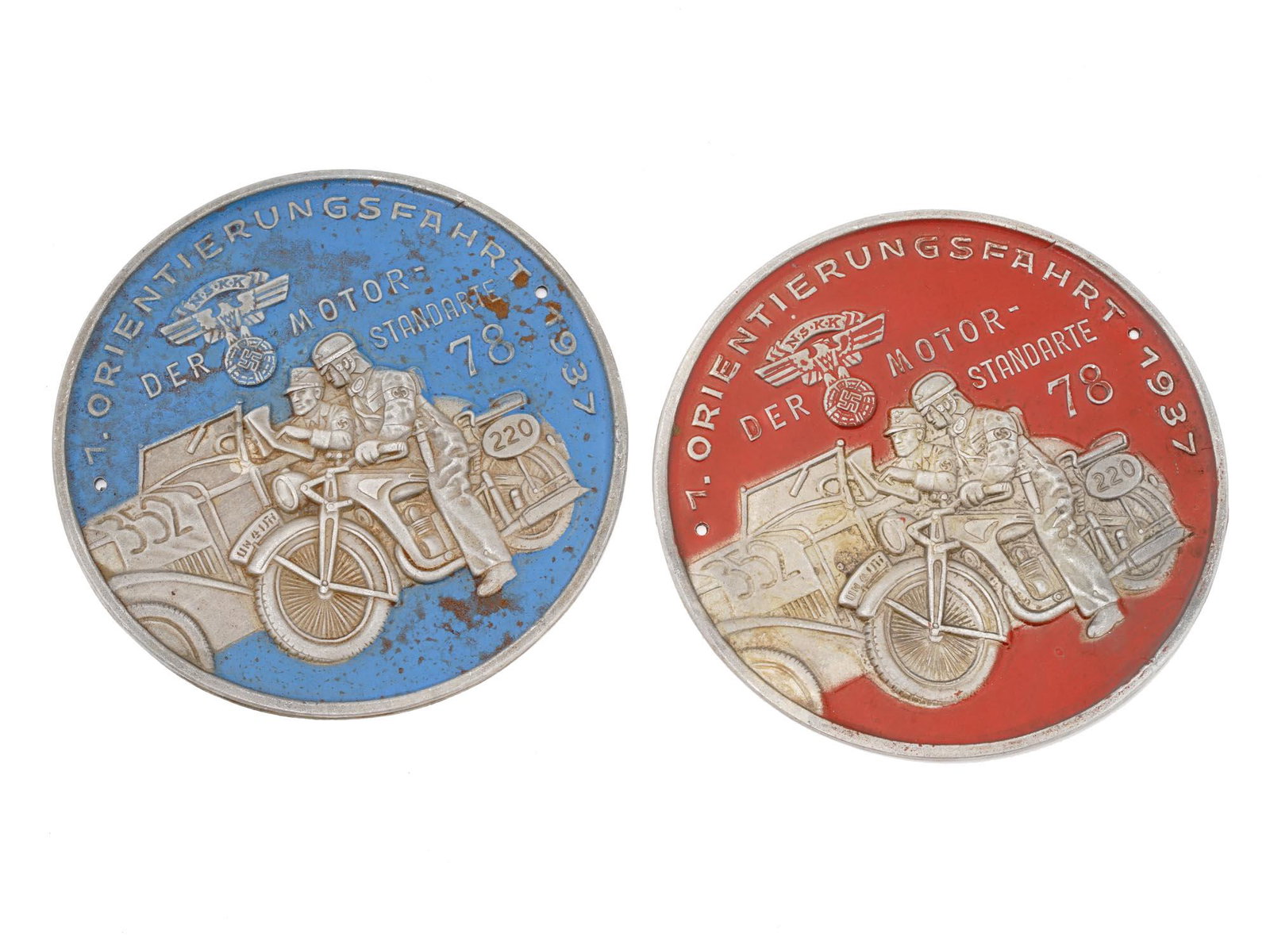 WWII NAZI GERMAN NSKK RALLY PARTICIPANTS PLAQUES: A pair of WWII Nazi German NSKK National socialist motor corps orienteering rally participants round shield plaques, covered with enamel in blue and red shades. Inscribed in German, Orientation drive 