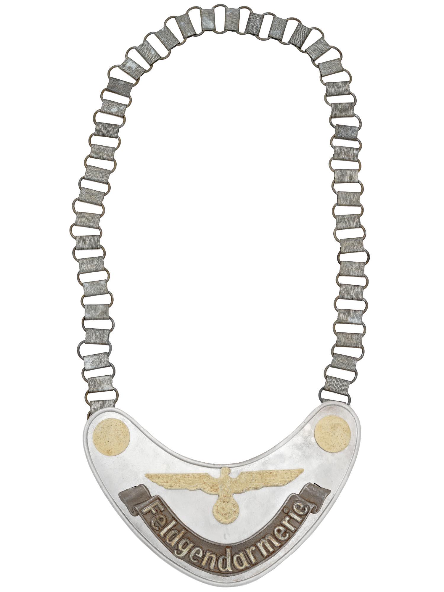 WWII NAZI GERMAN MILITARY FIELD POLICE GORGET: A WWII Nazi German Army Military Field Police Feldgendarmerie gorget of a die stamped steel construction aluminum coated, while the army eagle and buttons are painted with radium paint. The lettering
