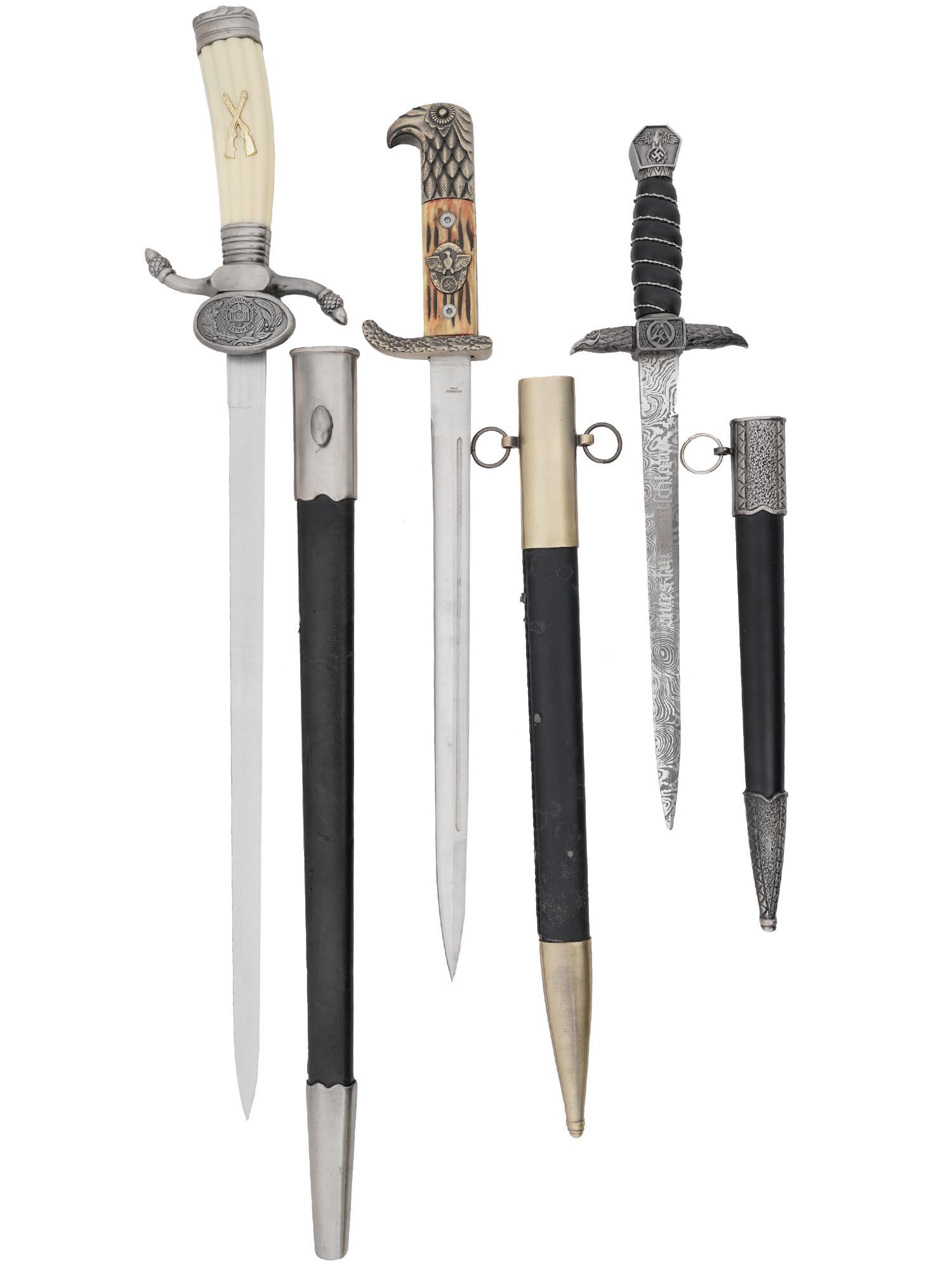 LOT OF WWII NAZI GERMAN DAGGERS WITH SCABBARDS: A lot of three German daggers, post WWII production. The first one is the German WWII hunting dagger with stag antler handle with Nazi symbol eagle with swastika and eagle head knob. Features a scabba