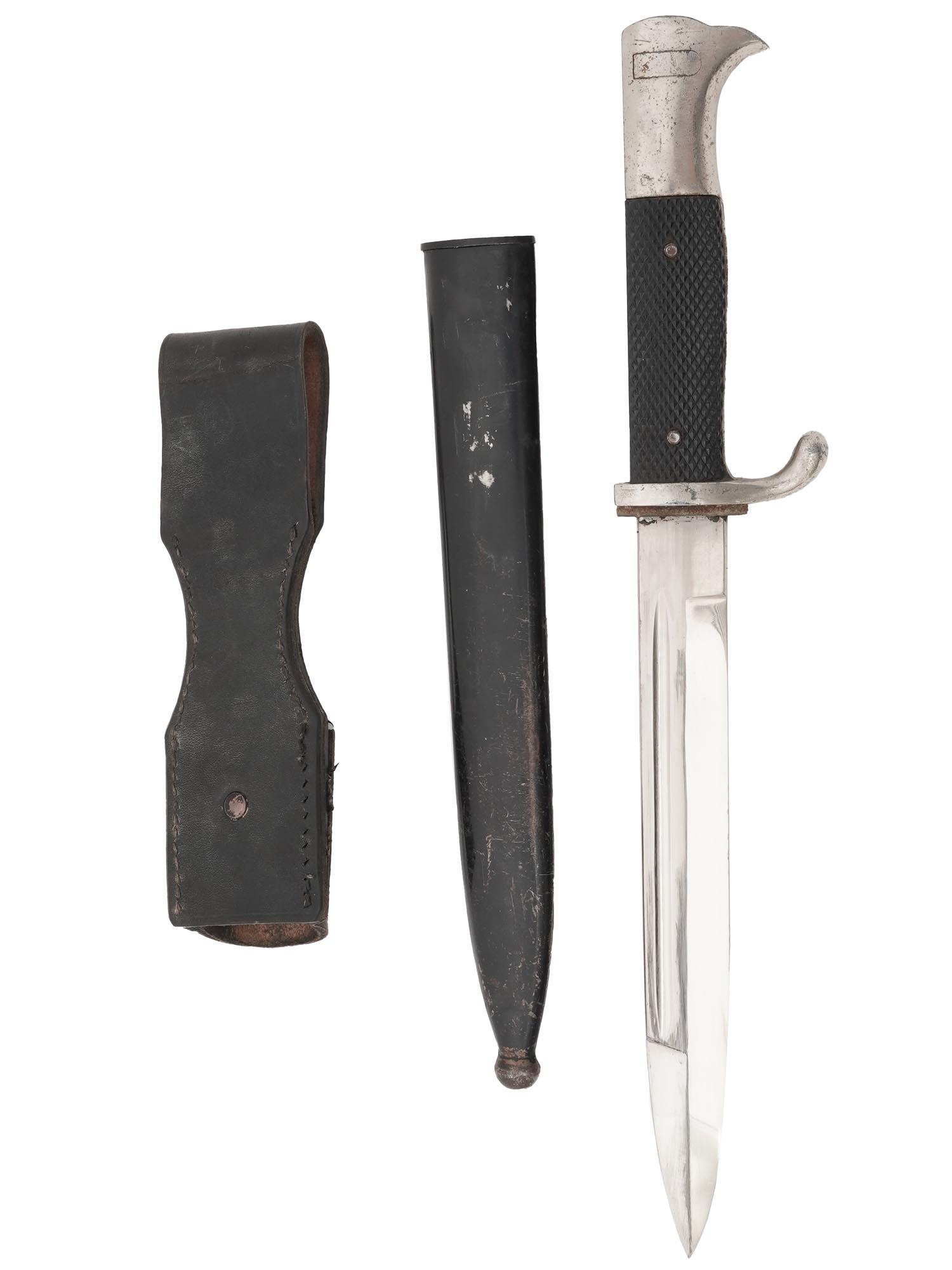 WWII NAZI GERMAN THIRD REICH K98 PARADE BAYONET: A WWII Nazi German Third Reich K98 parade bayonet featuring a straight single edged steel blade, eagle head pommel and black composition checkered grip. Complete with a scabbard and a leather frog. WW