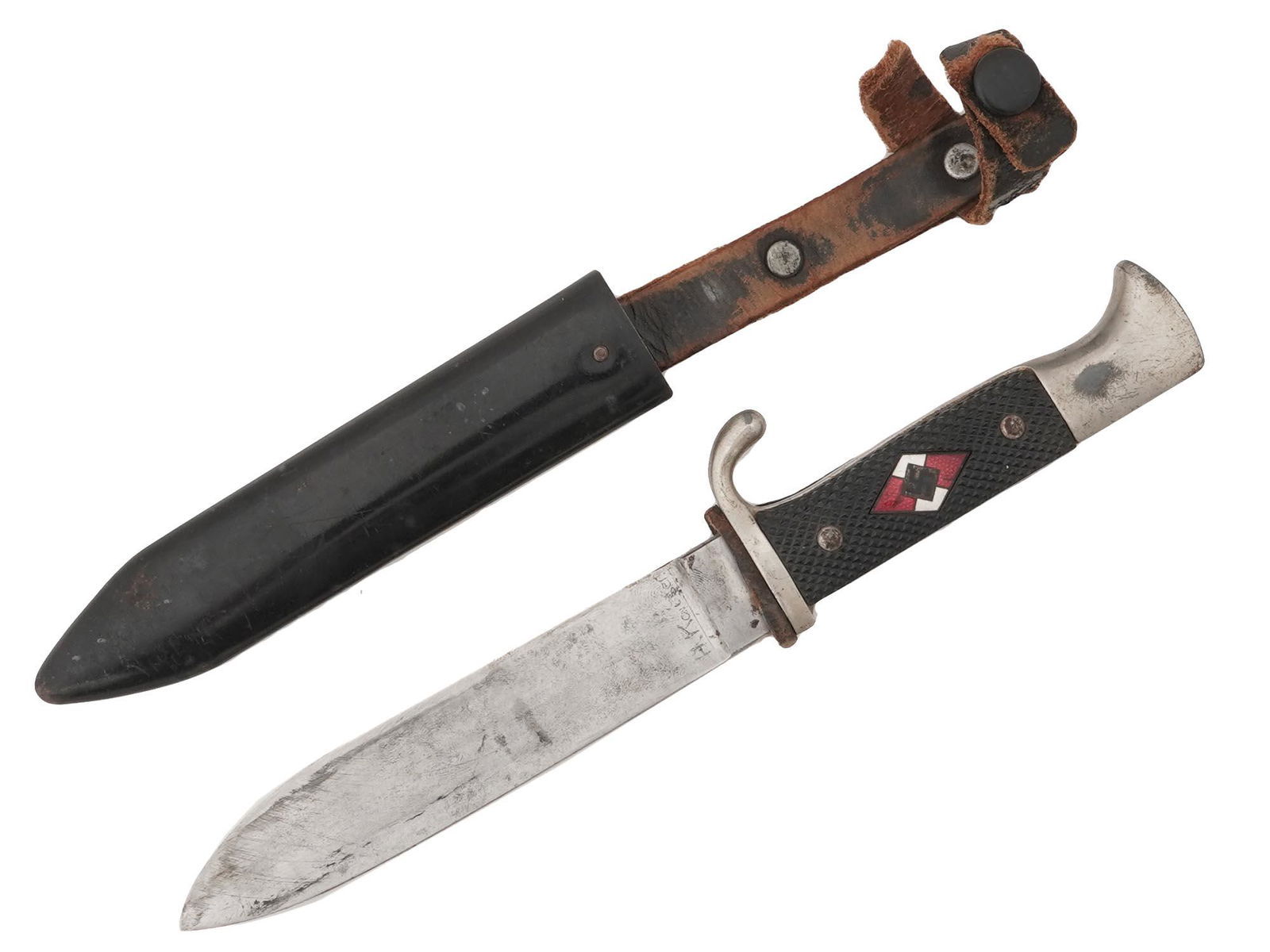 WWII NAZI GERMAN HITLER YOUTH DAGGER W SCABBARD: A WWII Nazi German Third Reich Hitler Youth member dagger. Completed with an original magnetic sheet metal scabbard. The knife has molded, black bakelite grips with an enameled rhomboid swastika insig