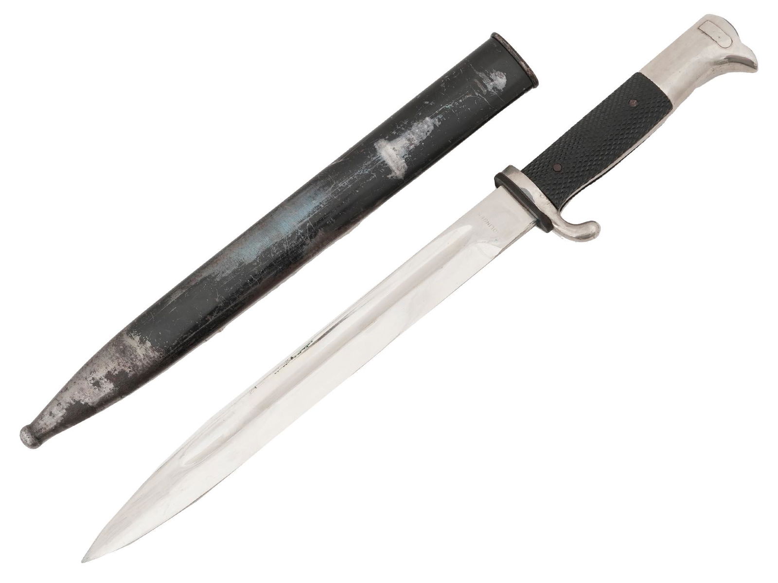 WWII NAZI GERMAN CLOSE COMBAT DAGGER IN SHEATH: A World War II German close combat dagger. Stainless-steel blade, black bakelite handle. Steel scabbard. Solingen trademark is on the blade by the handle. The German combat knives became a favorite wa