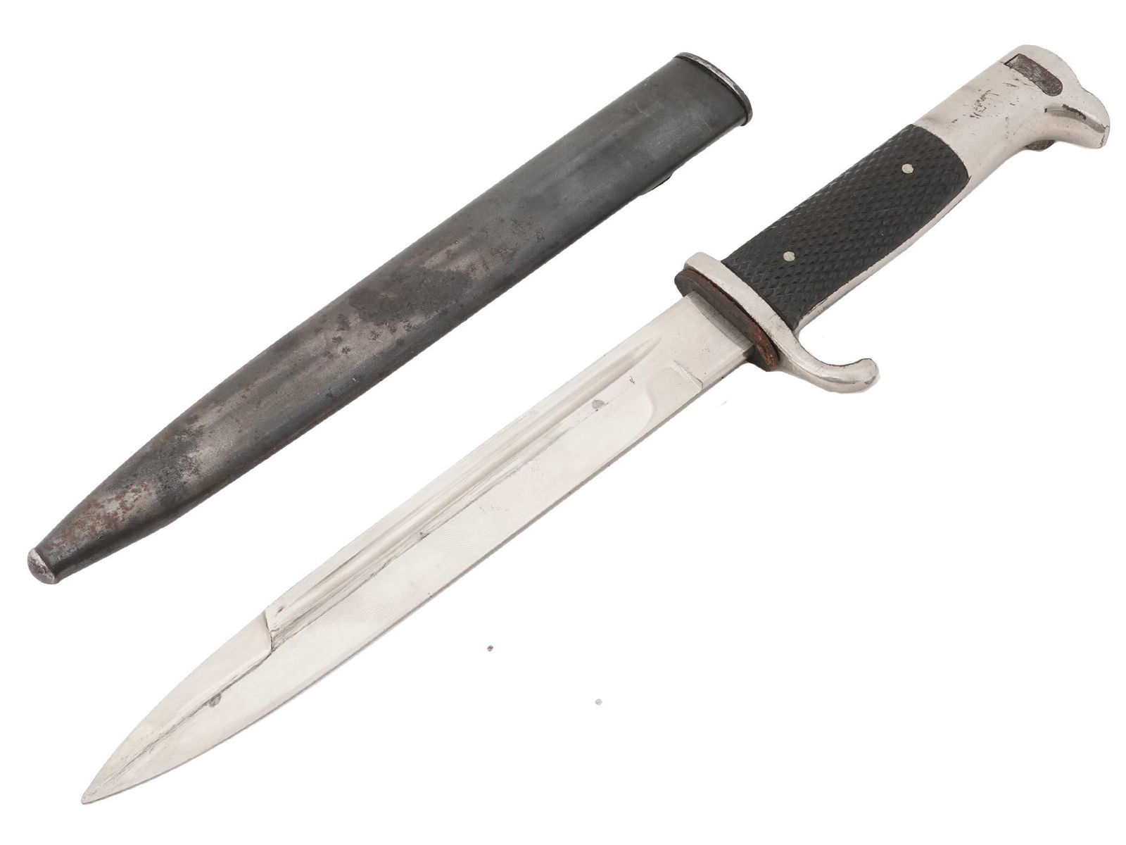 WWII NAZI GERMAN CLOSE COMBAT DAGGER IN SHEATH: A World War II German close combat knife, the Nahkampfmesser. Stainless-steel blade, black bakelite handle. Steel scabbard. The blade is marked F.W. Holler Solingen by the handle. The German combat kn